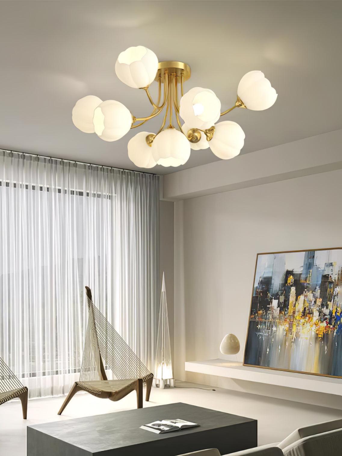 Brass-colour Pumpkin ceiling light with white lobed shades above rope chairs and a black table