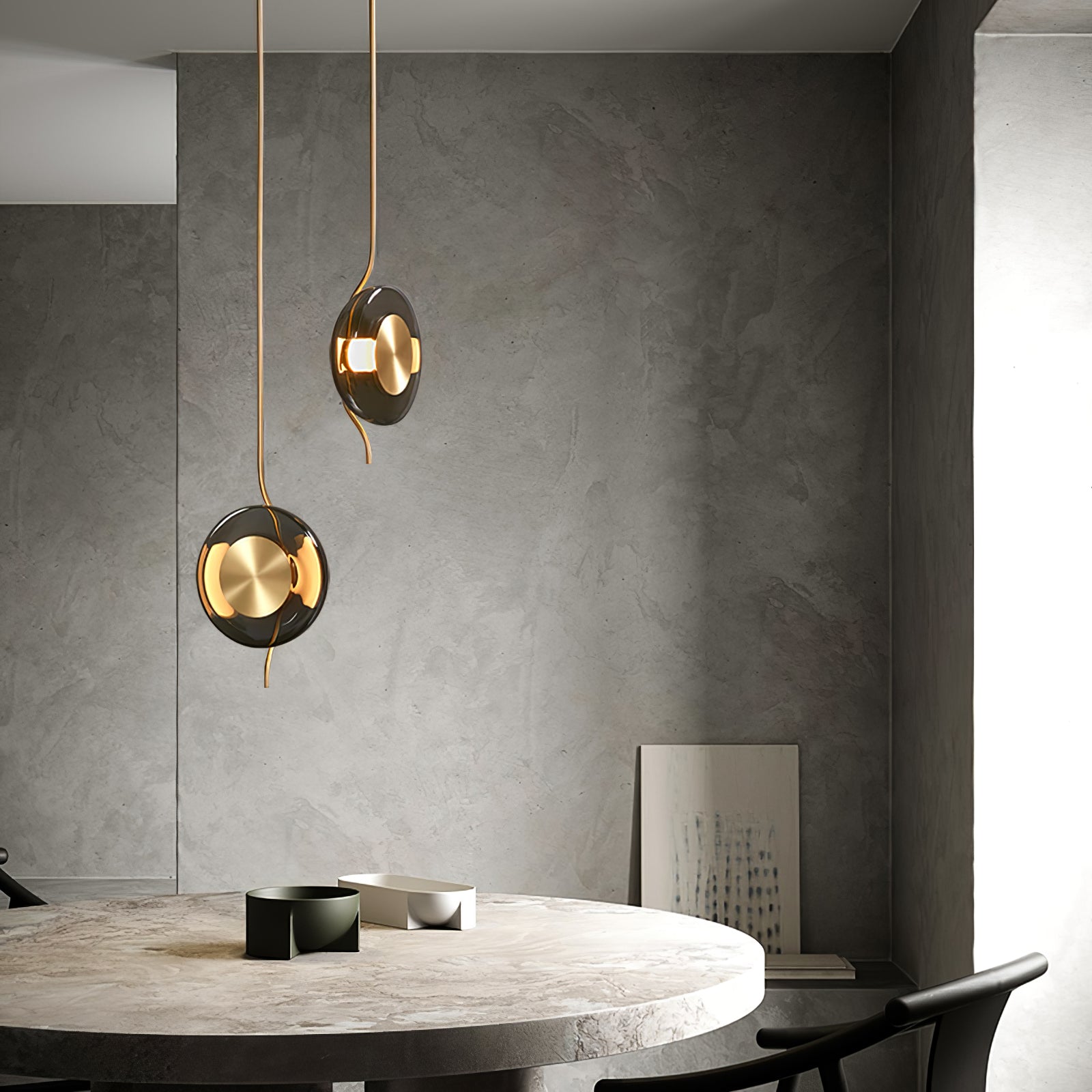 Pendulum LED pendant light with a curved glass disc and circular metal centre