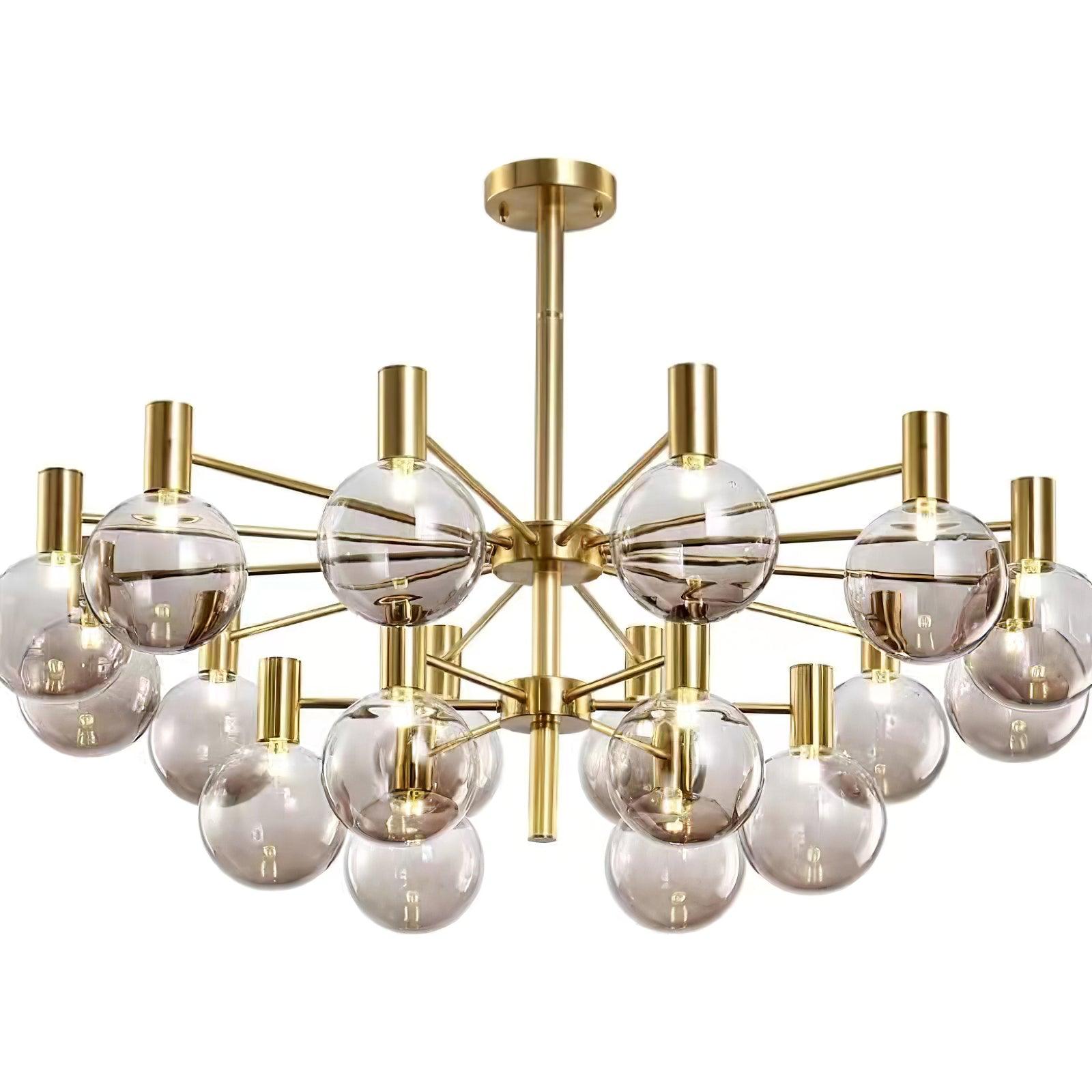 Close view of a lit two-tier clear-globe chandelier with gold-tone hubs and rod, with outer globes cropped at the edges.