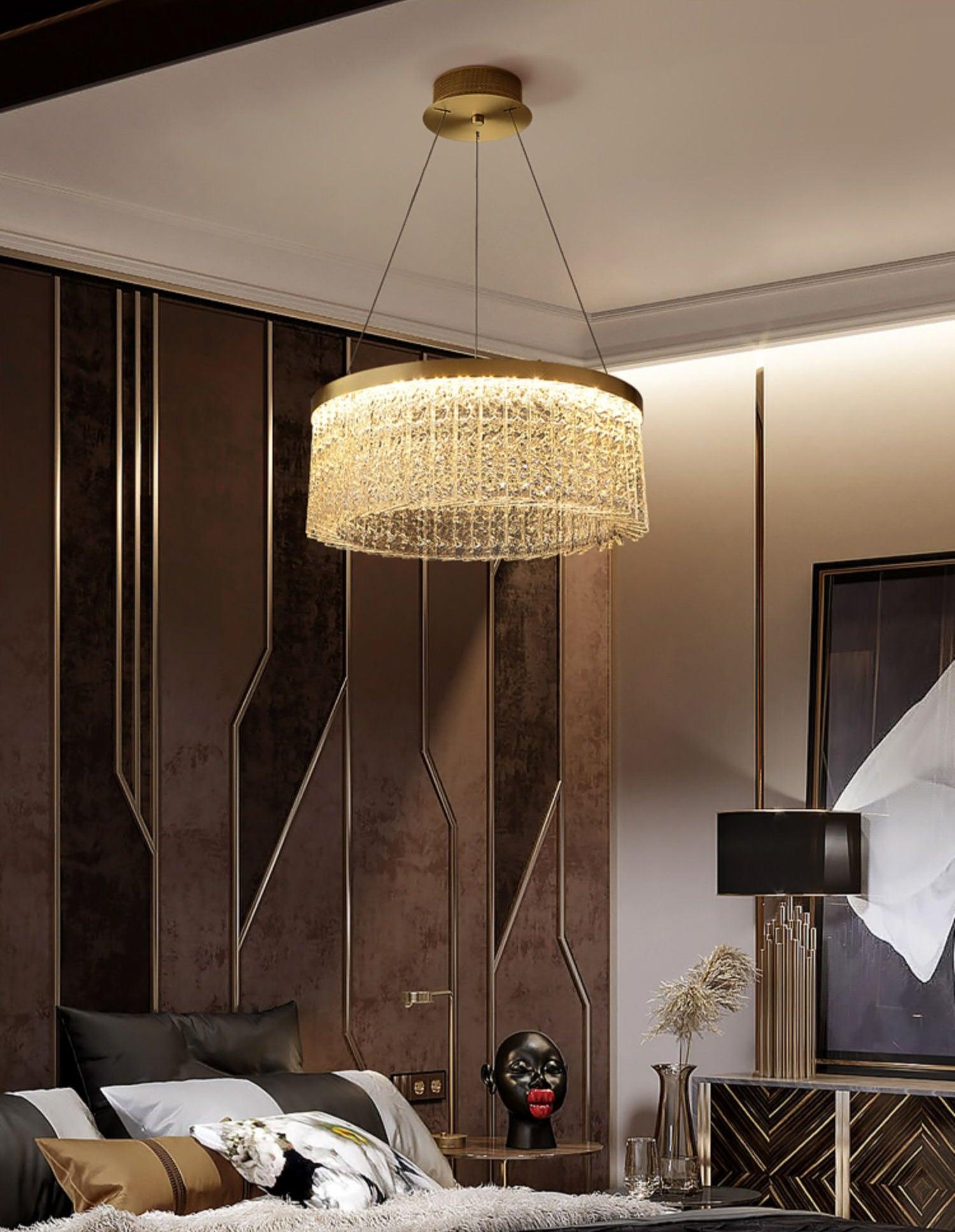 Crystal ring over a dark bedroom arrangement with black-shade table lamp, portrait and patterned wall