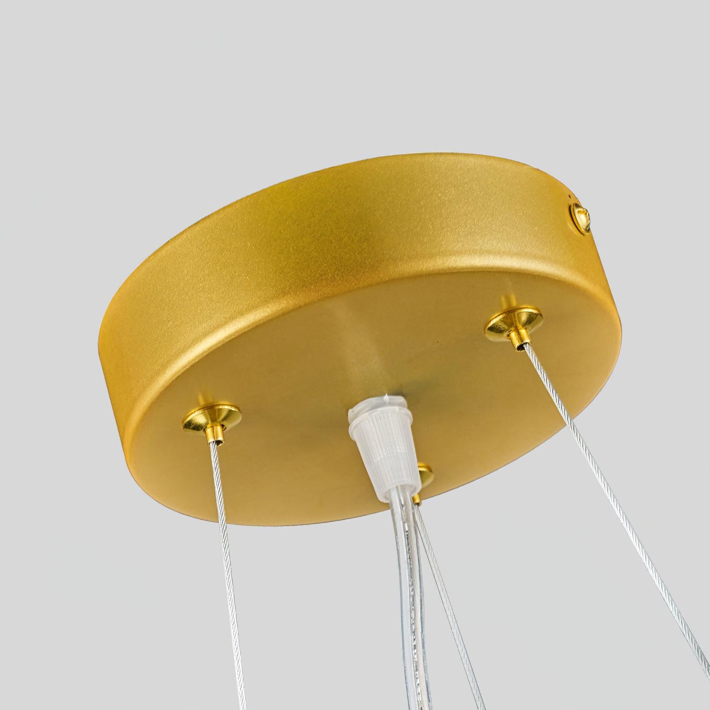 Close round gold-tone ceiling canopy with three thin suspension cables and a central clear wire