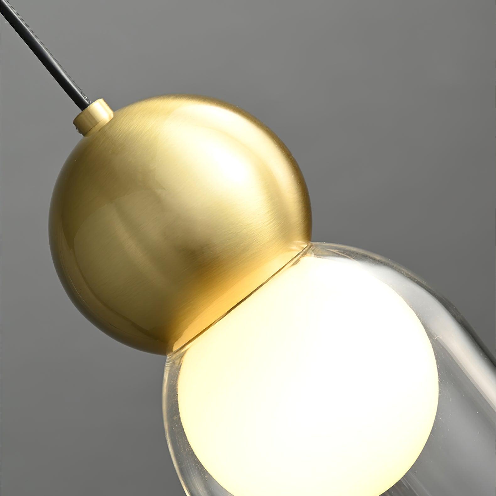 Close-up of the Brass sphere, pale bulb and clear glass sleeve