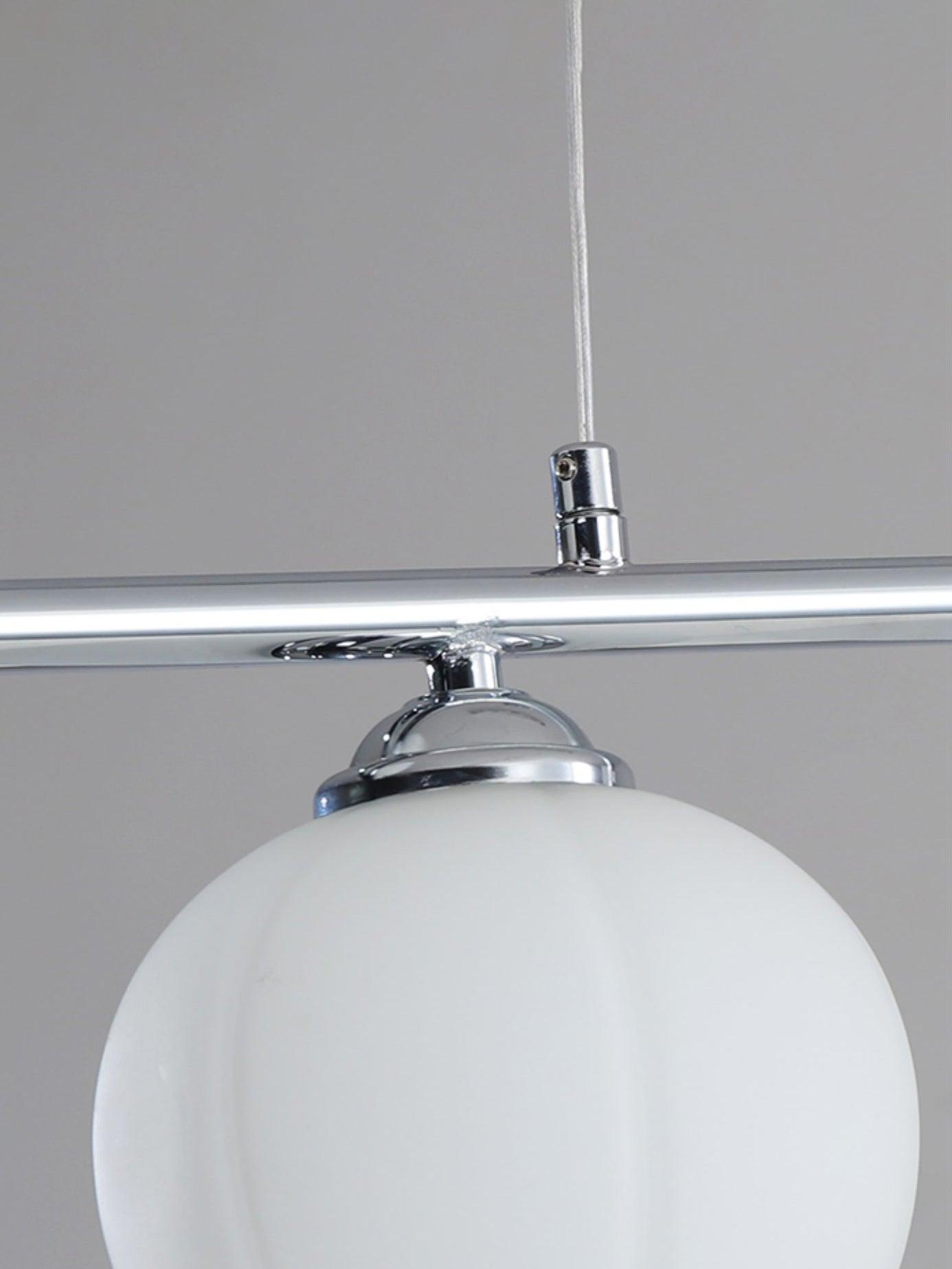 Floral Glass cable connector and shade fitting on the chrome bar