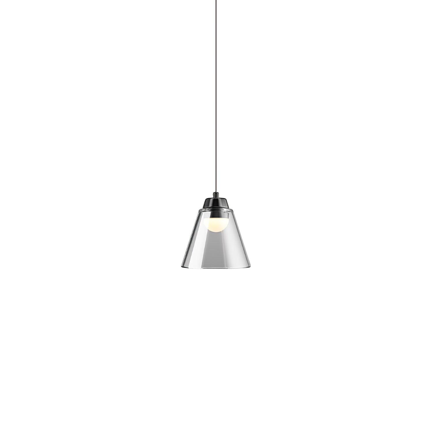 Single clear cone pendant illuminated on a pale background