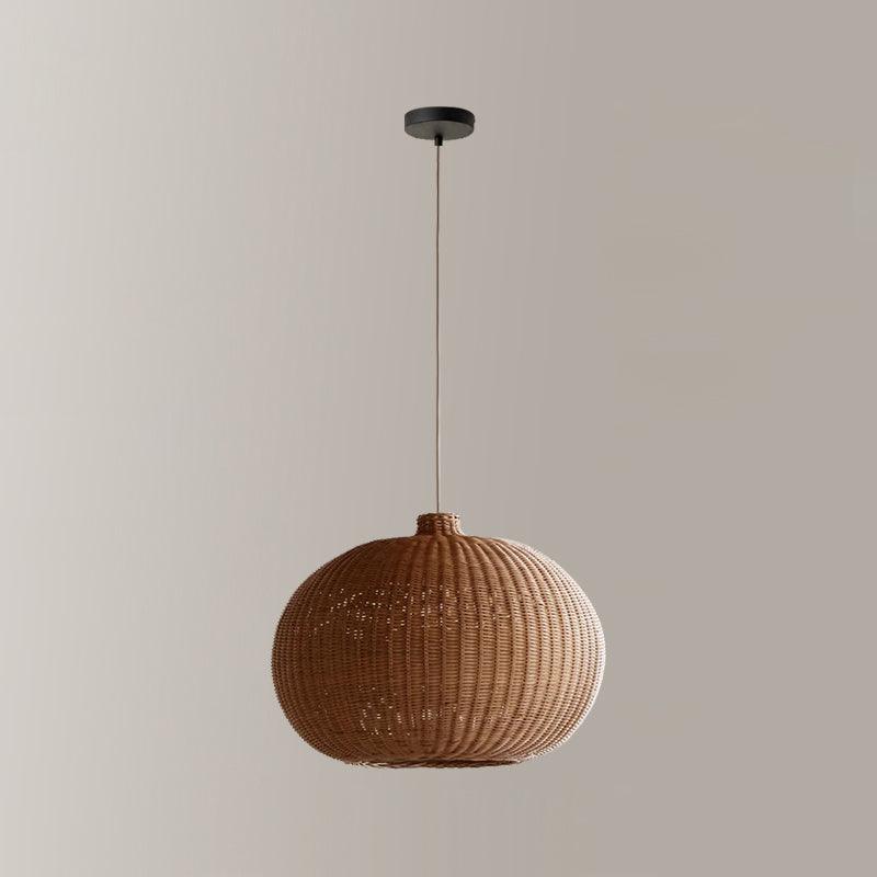 Brown rounded woven shade with dark canopy and cord