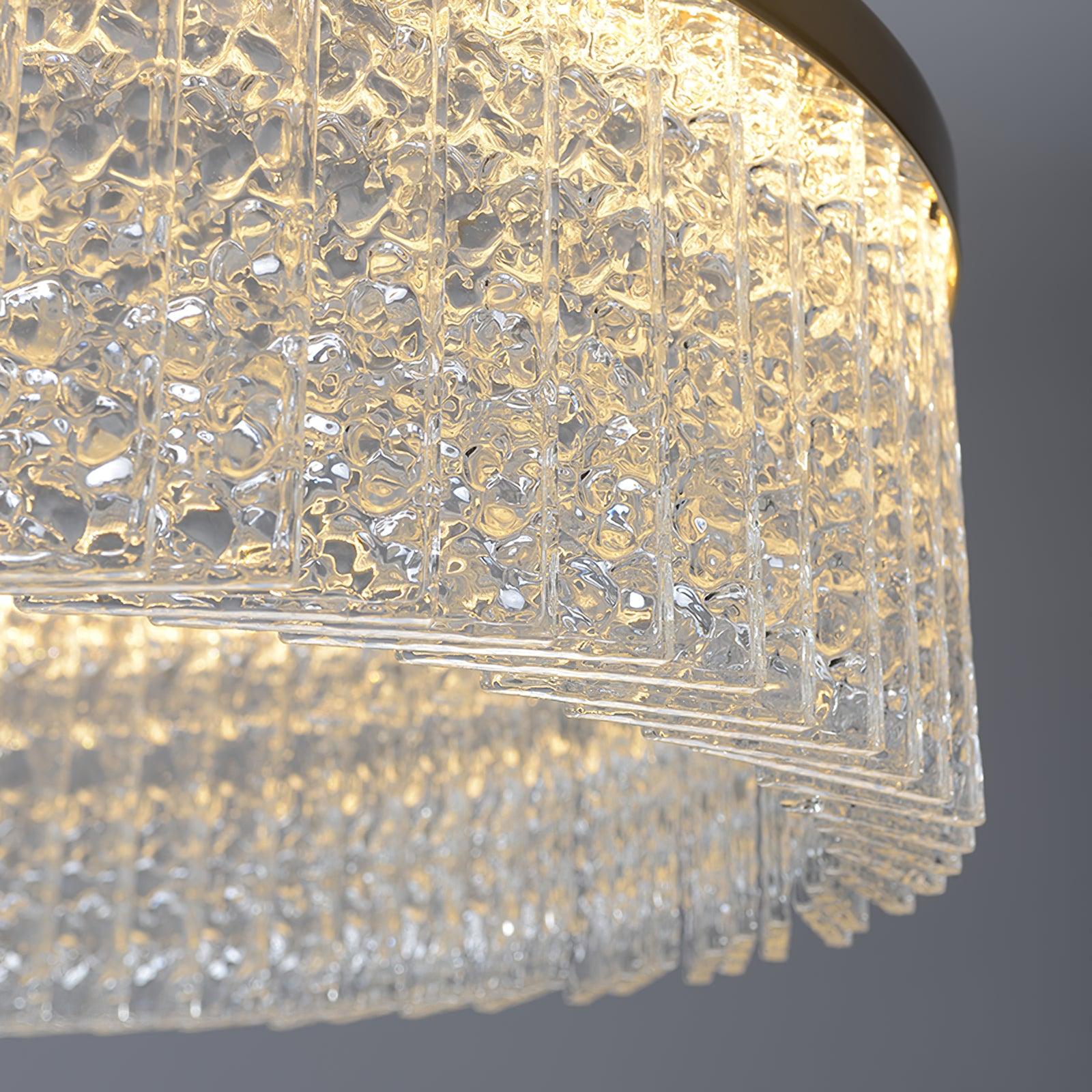 Close-up of clear textured rectangular crystal panels around the ring, showing stepped lower edges and interior reflections