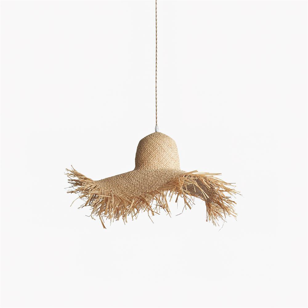 Unlit whole rattan hat shade on white, showing rounded crown, broad uneven fringed brim and tan cord