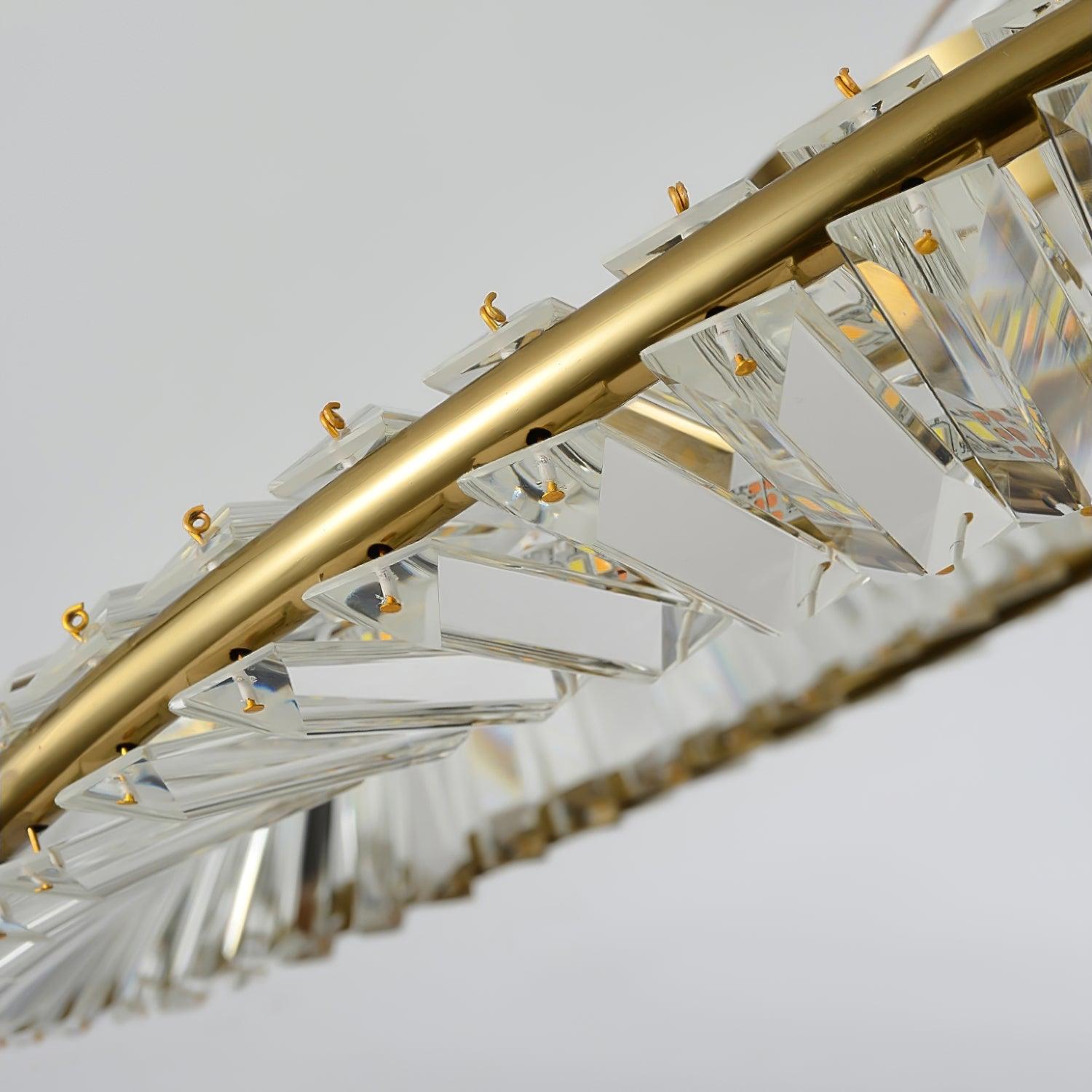 Angled close-up of unlit clear glass prisms and small gold-tone fixings along the ring