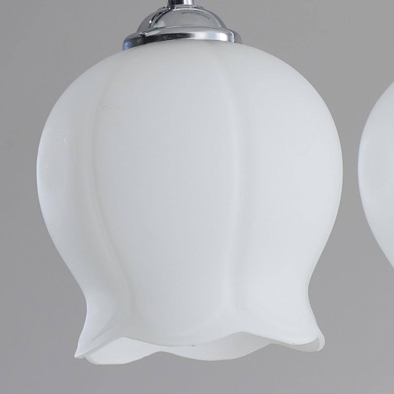 White bellflower-shaped glass shade with vertical lobes and scalloped edge
