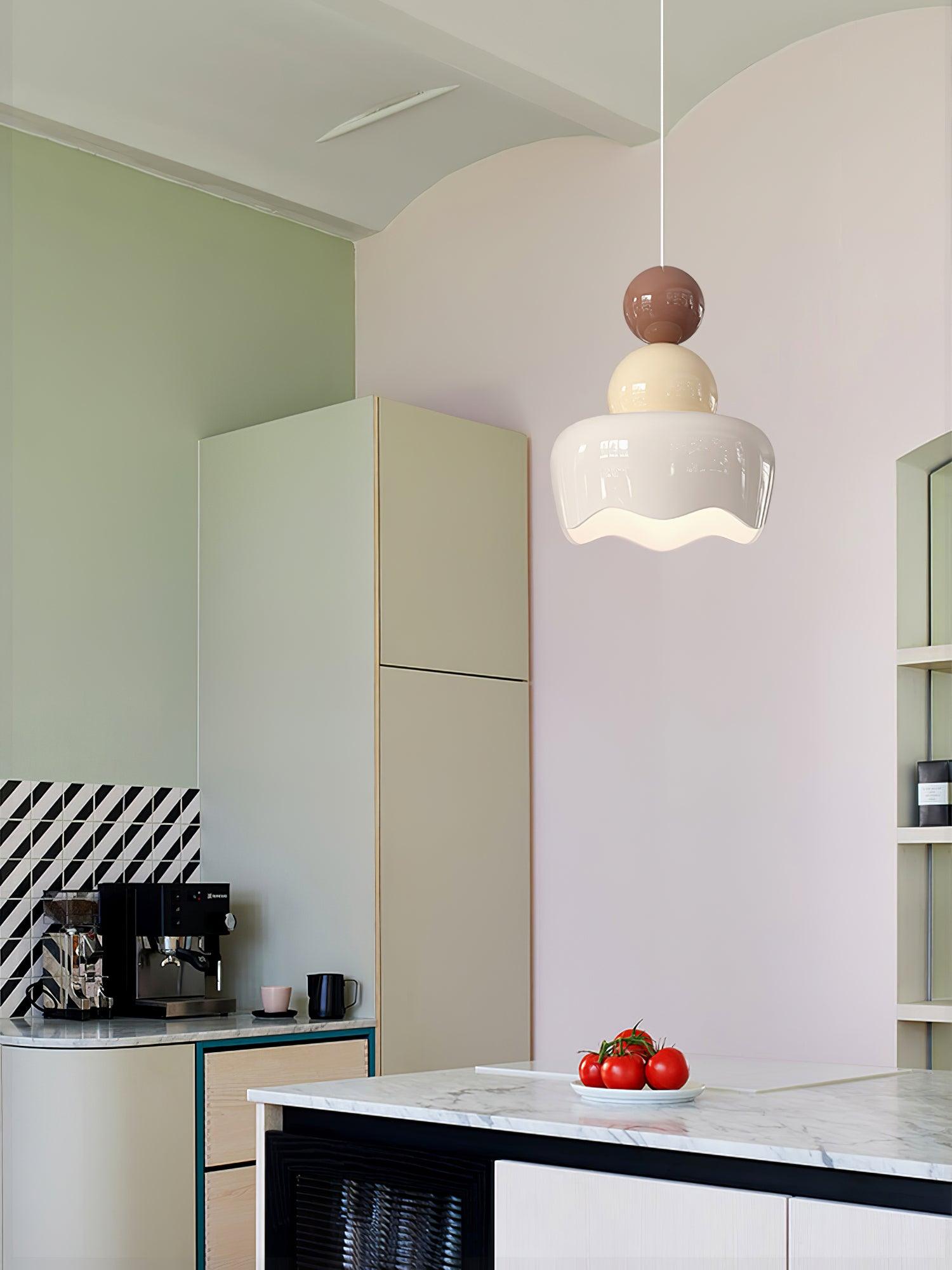 White-shade doll pendant above a kitchen counter