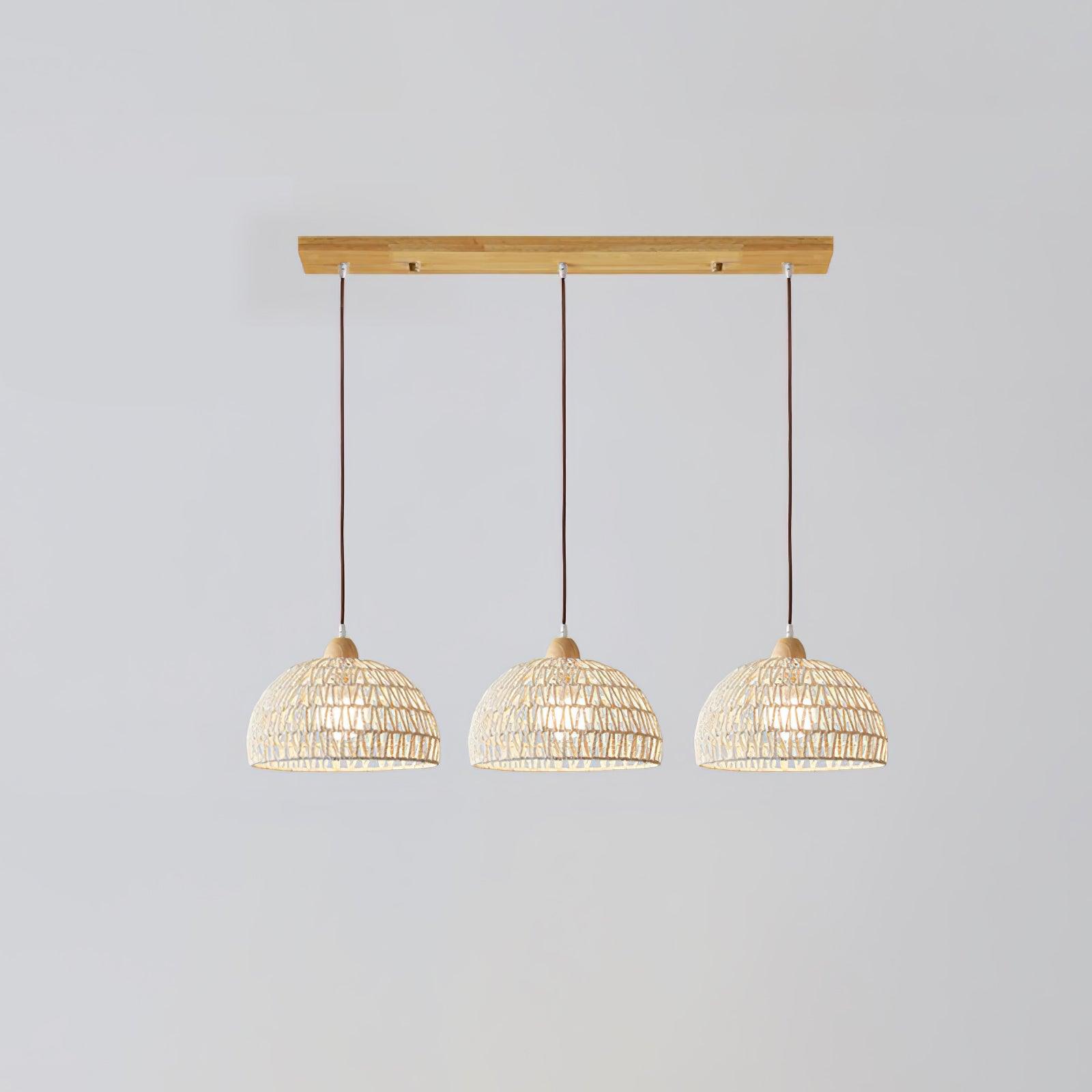 Three matching woven domes in a line on brown suspensions below a rectangular wood-grain ceiling bar