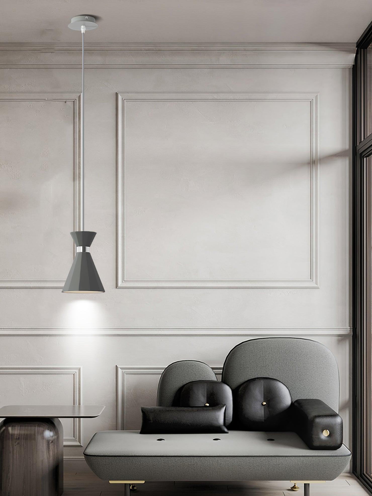 Grey pendant beside a lounge chair
