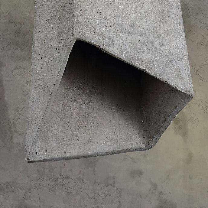 Rough cement surface inside an angular shade opening