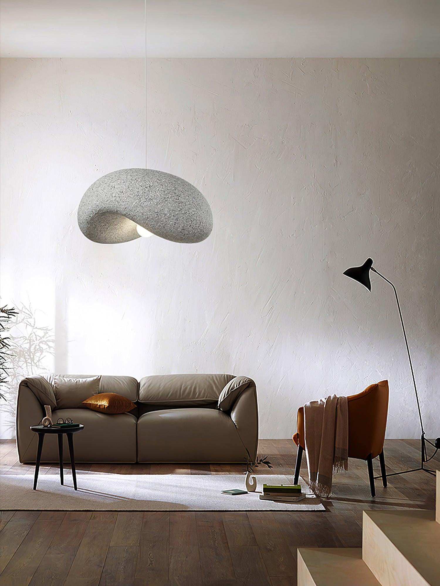 Gray curled shade above a seating arrangement