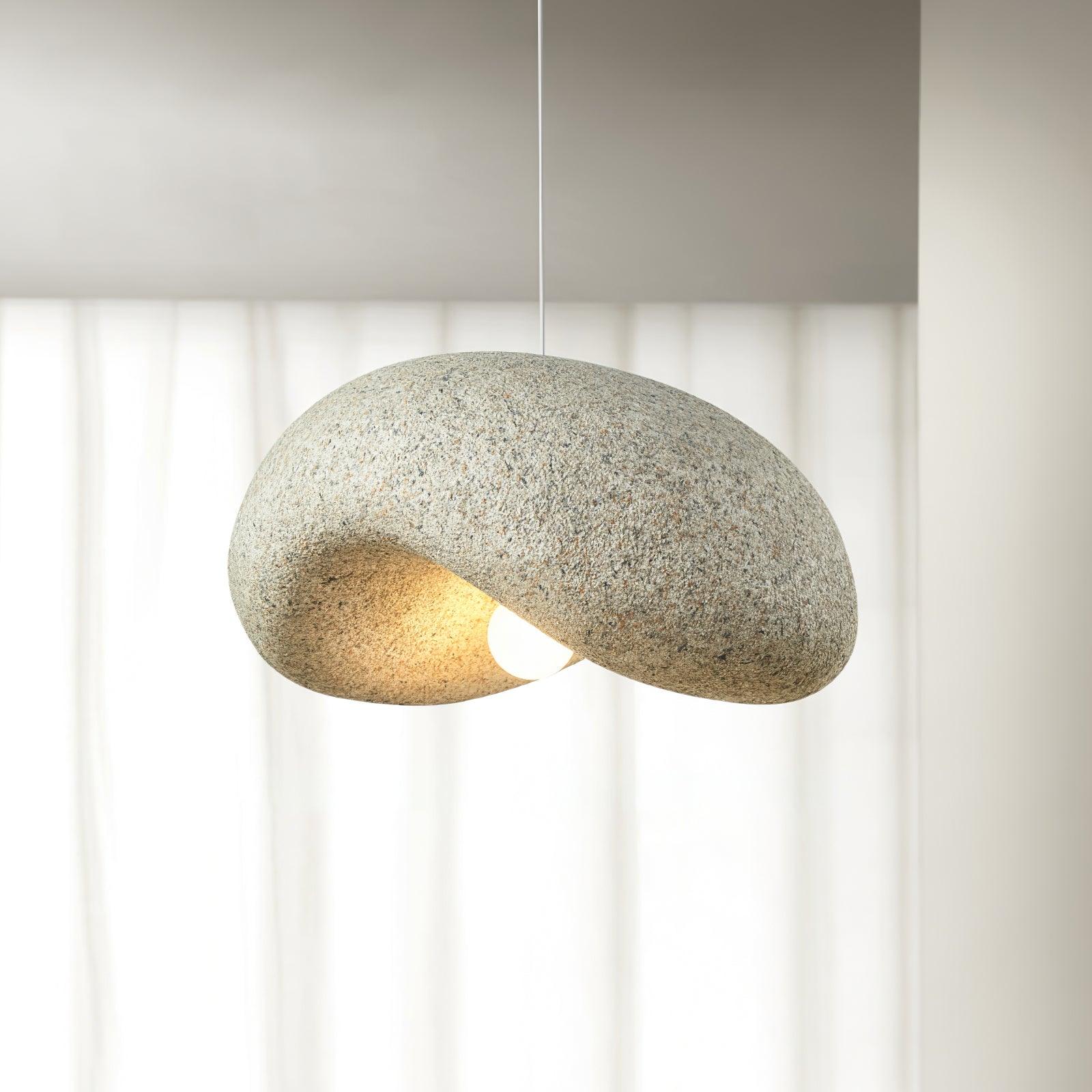 Yellow organic pendant beside a window