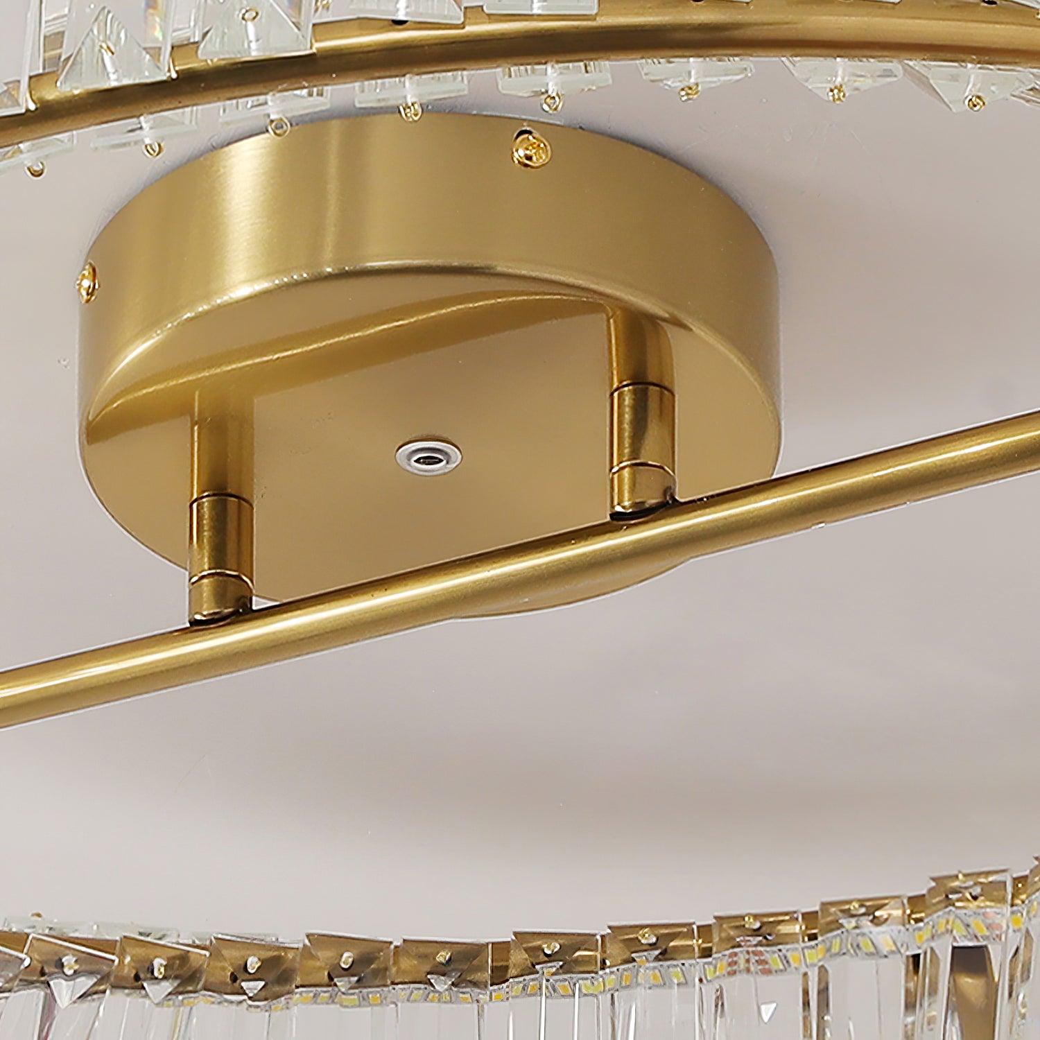 Close-up of the round gold-tone canopy, short supports, crossbar and LED strip along the glass ring