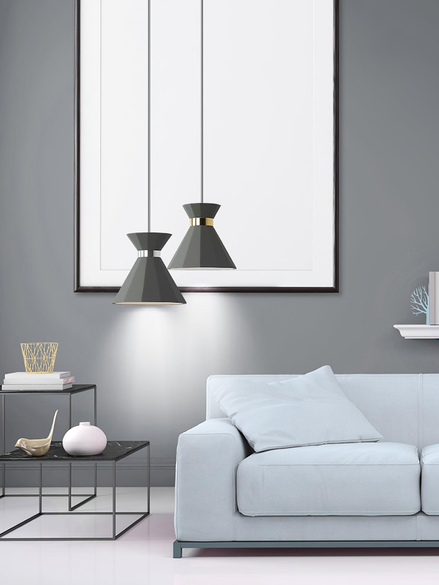 Two grey pendants beside a sofa and mirror