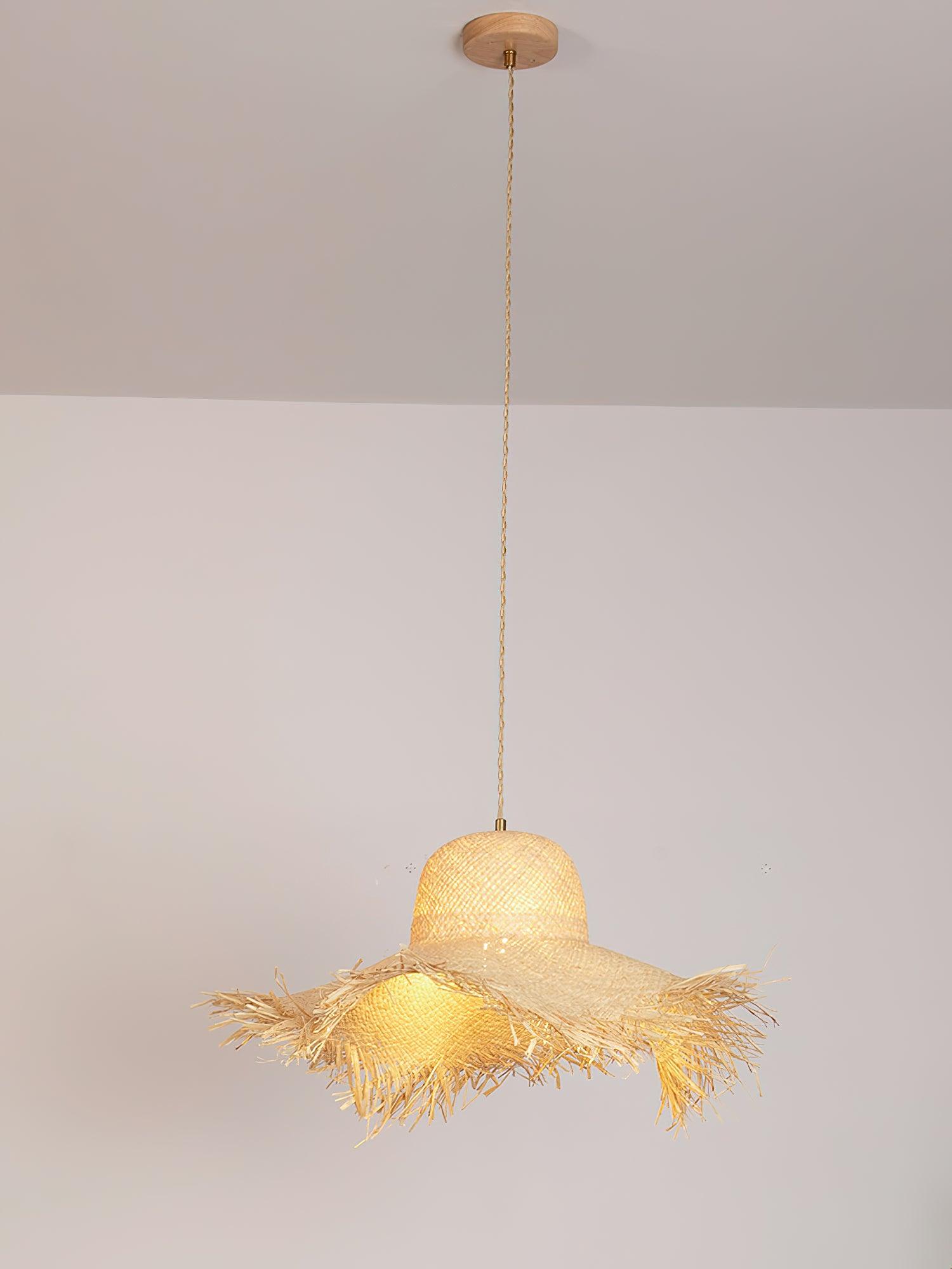 Full lit hat pendant on tan twisted cord from a round canopy, with warm-looking light through the weave