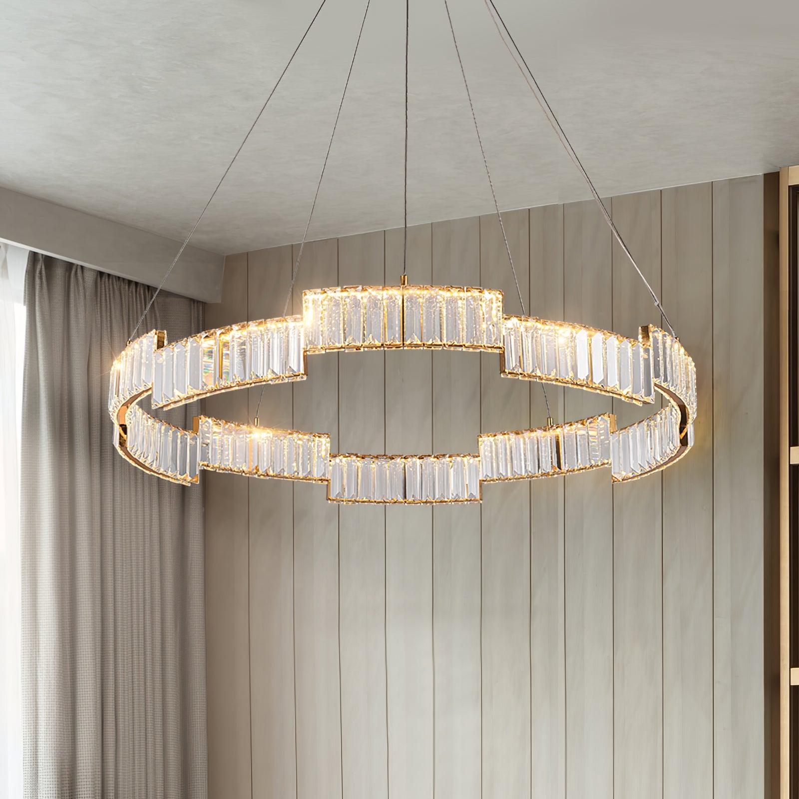 Close lit clear faceted panels and stepped gold-tone rails against a wooden wall and curtains