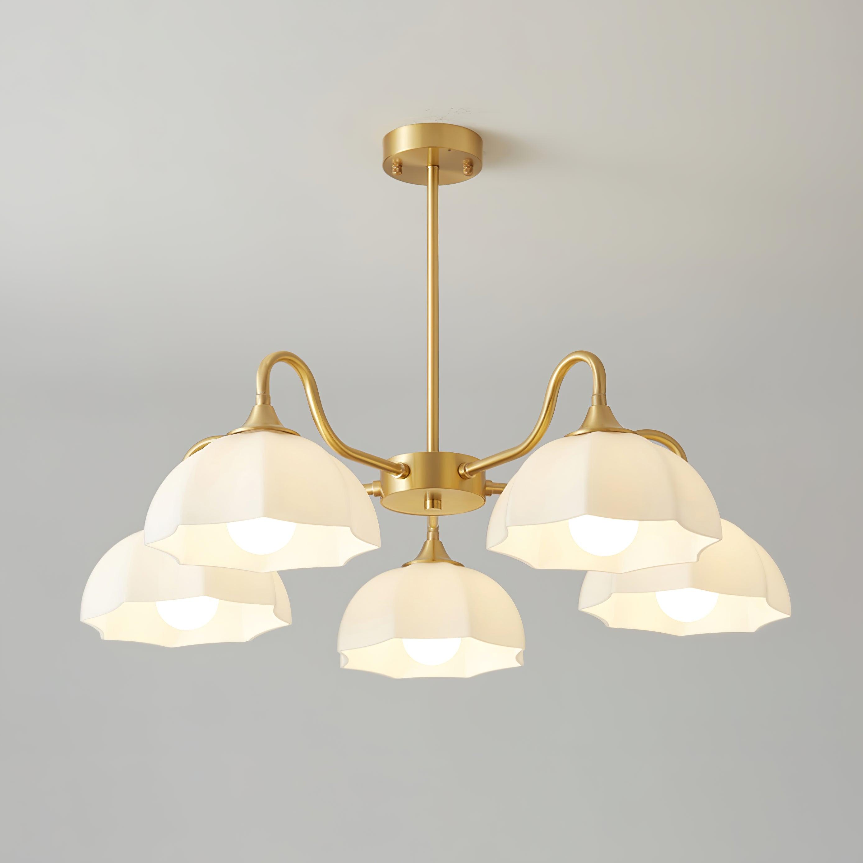 Five-head brass chandelier with white glass bowls