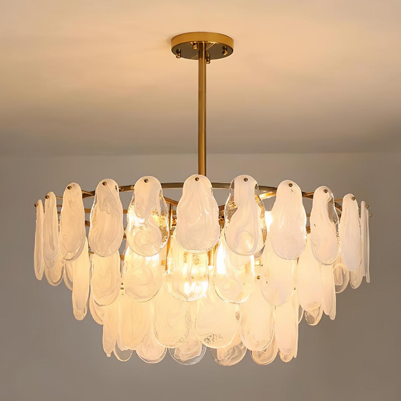 Illuminated circular Round Cloud pendant with a long central rod against a warm grey background