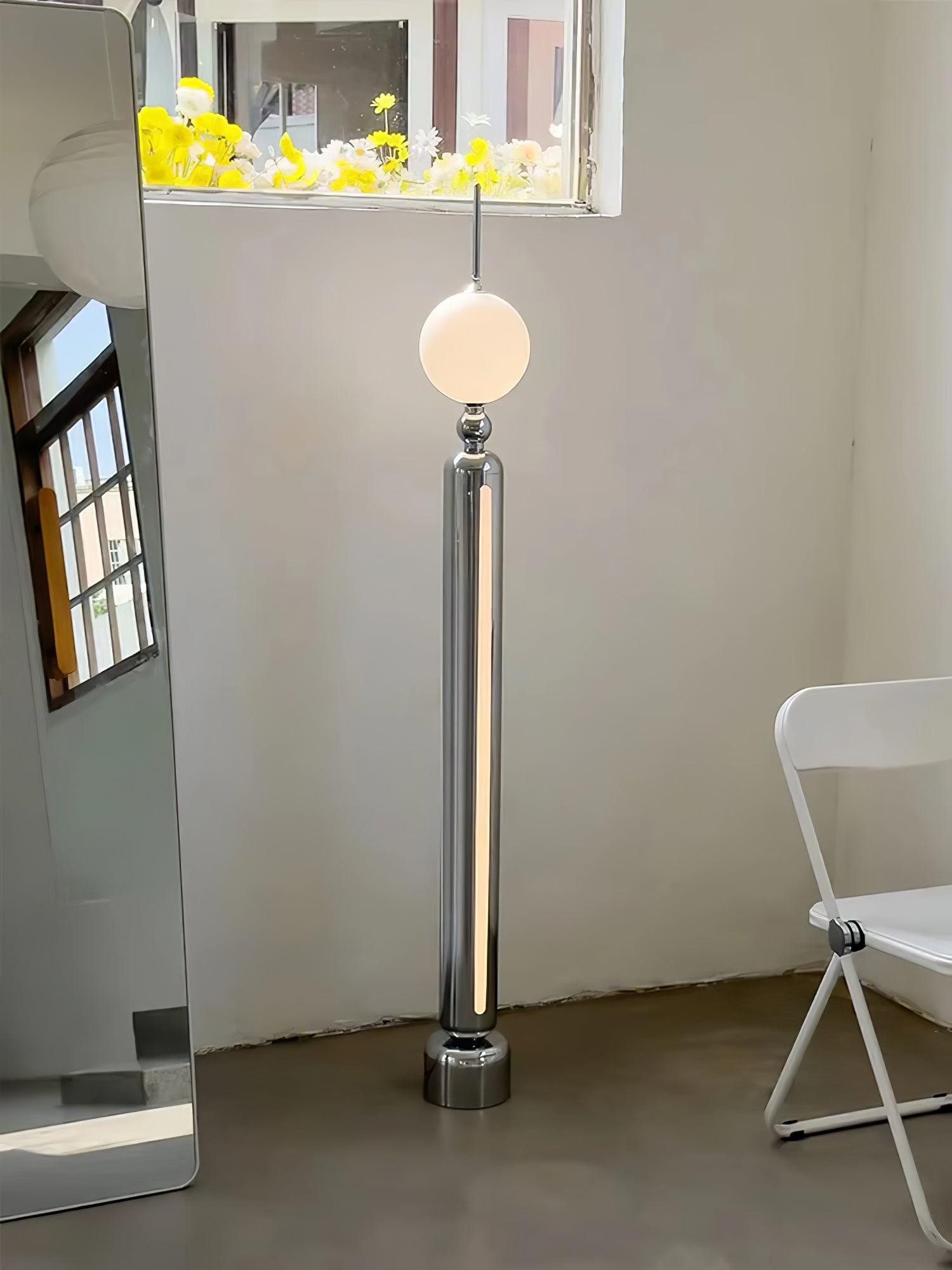Lightning Rod chrome floor lamp with a white globe and vertical light strip
