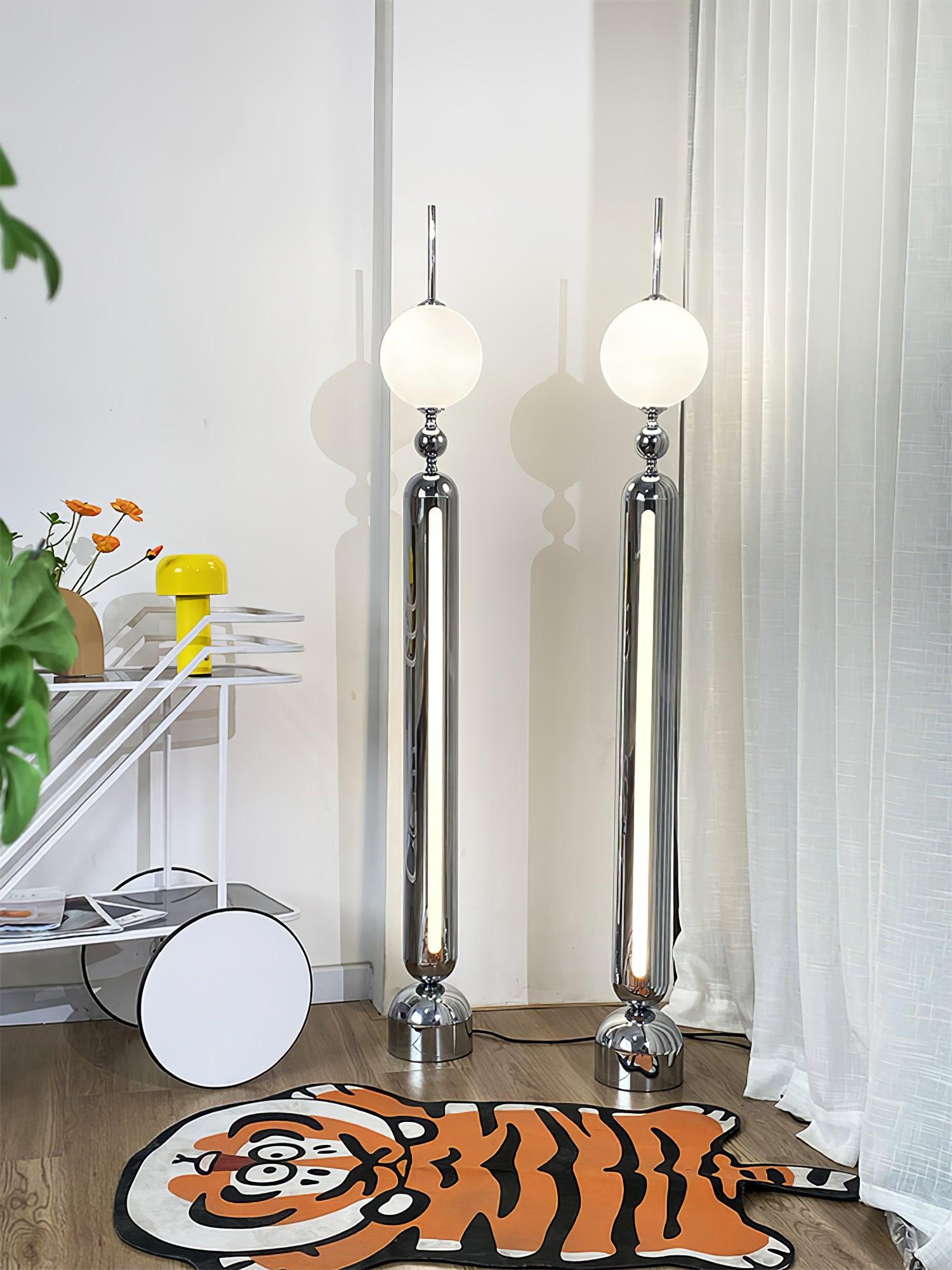 Lightning Rod chrome floor lamp with a white globe and vertical light strip