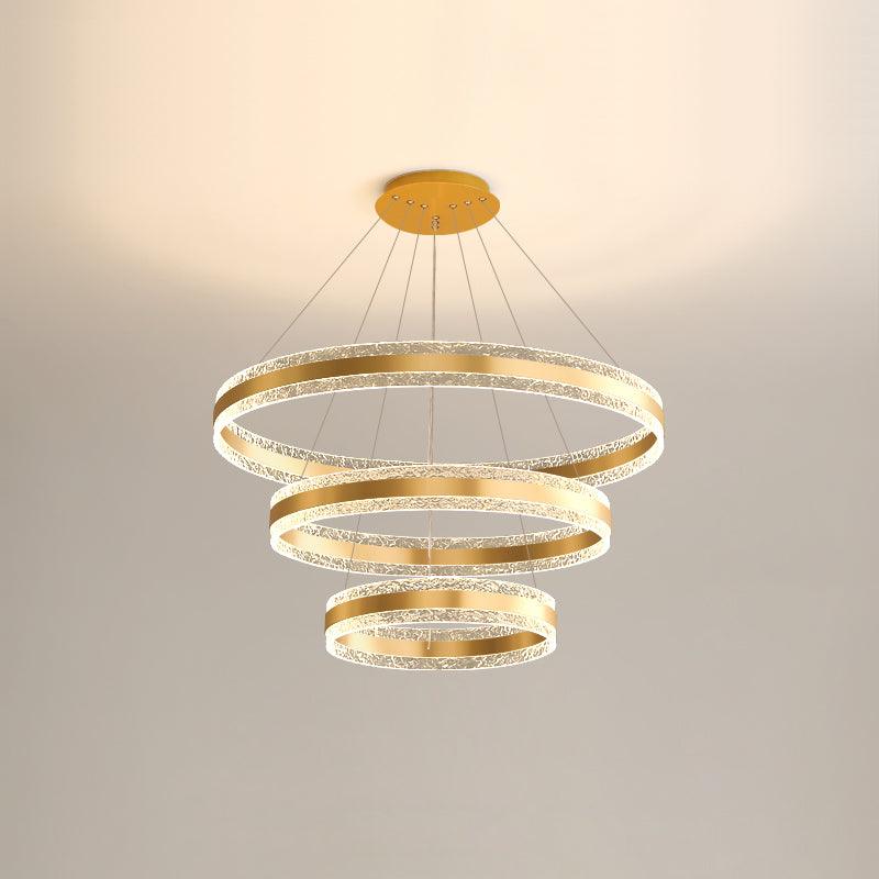 Three-layer Gold option showing three descending gold-tone LED rings on thin wires beneath a round canopy