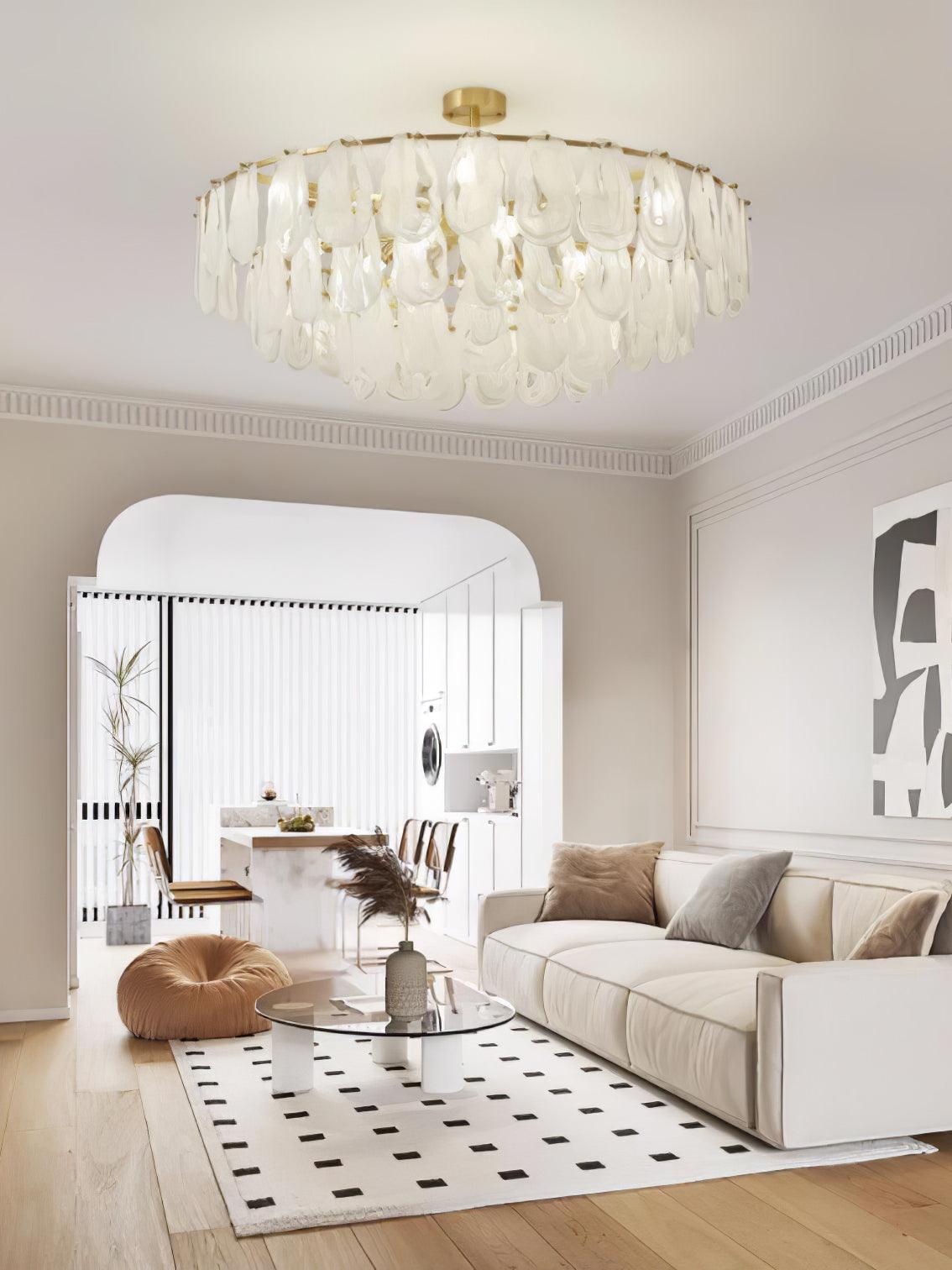 Circular Round Cloud pendant above a light sofa beside an arched doorway
