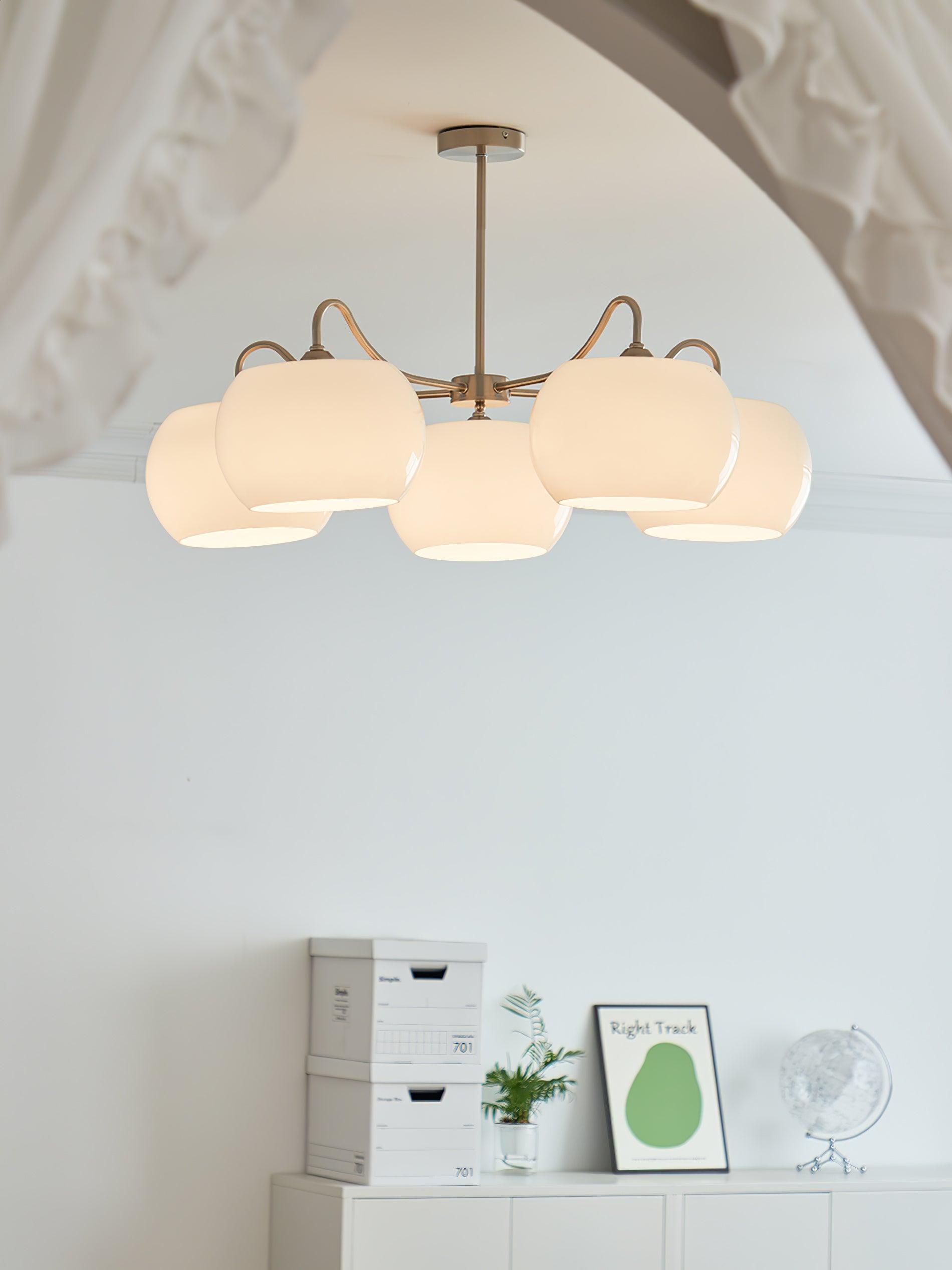 Persimmon chandelier with white glass shades and curved nickel-tone arms