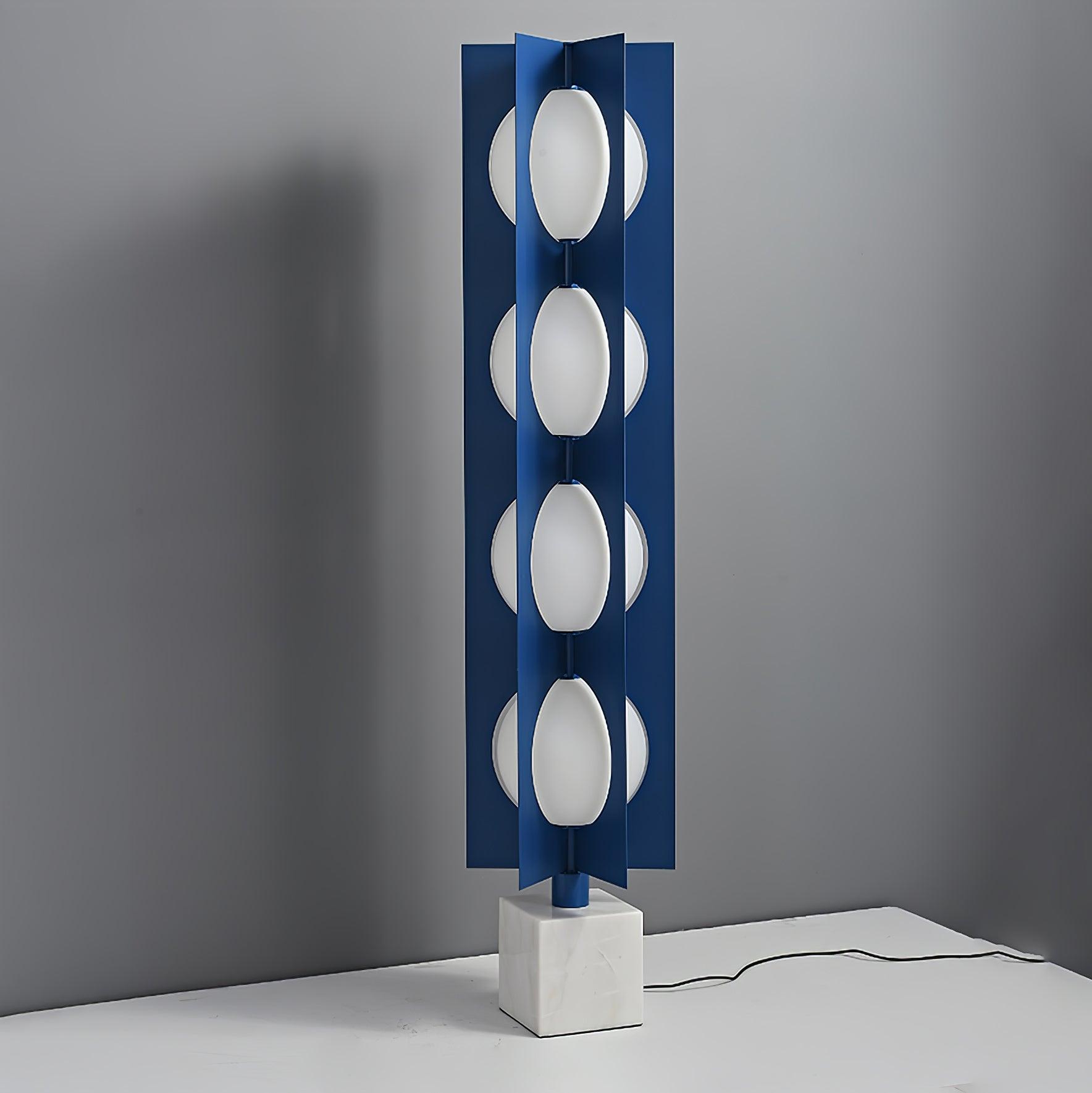 Four unlit white shade levels on the blue column above a marble base with the lead running to the right