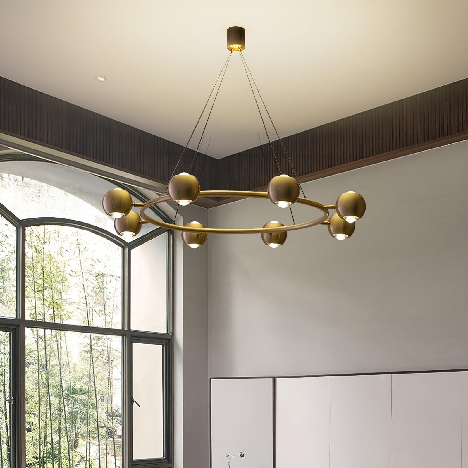 Ring chandelier beside a large window