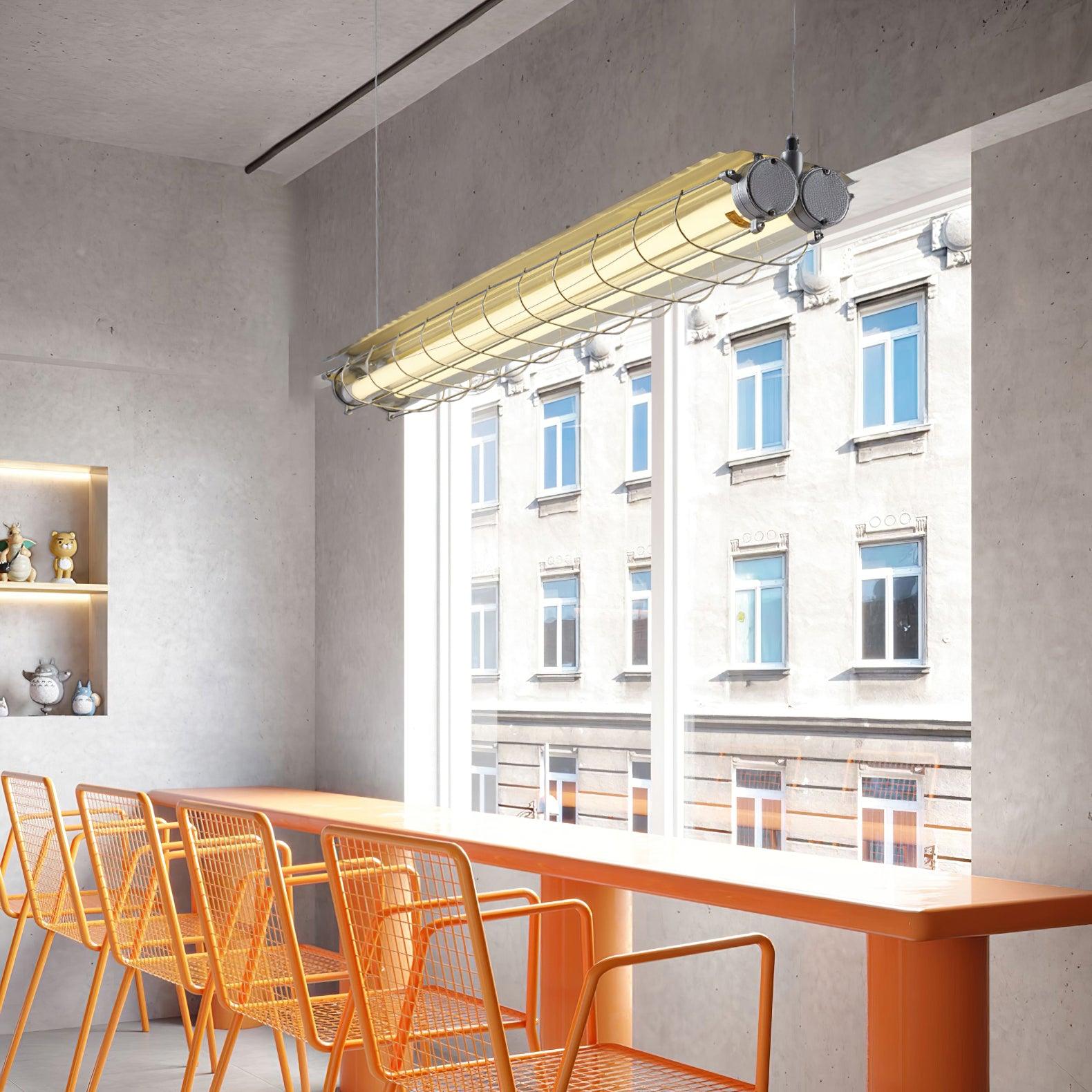 Angled Artisan Glass chandelier above a window-side counter with tall orange stools