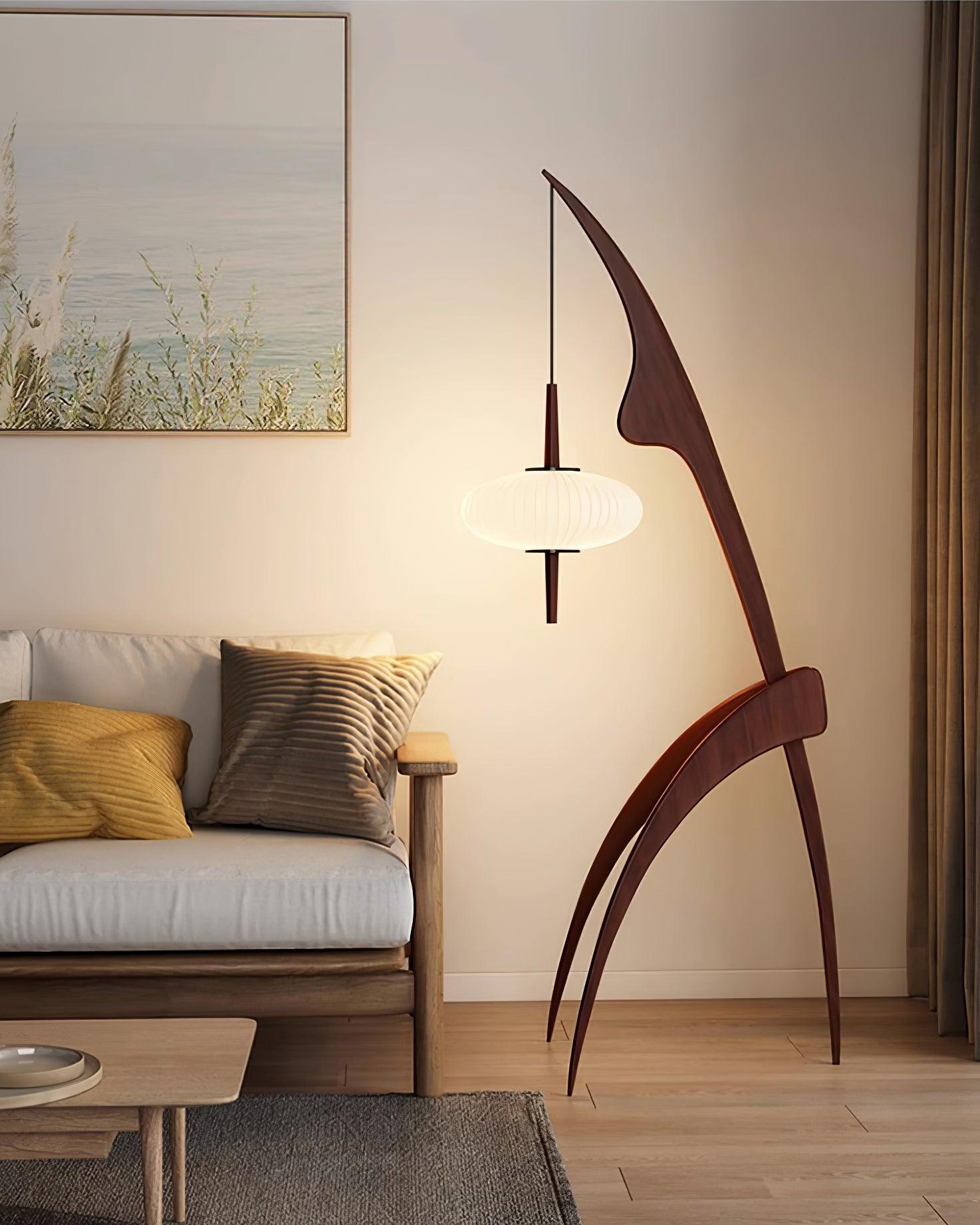 Walnut-colour Mantis lamp with a suspended glowing white shade