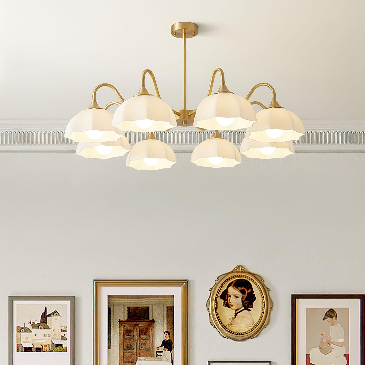 Wide white glass shade chandelier over wall pictures