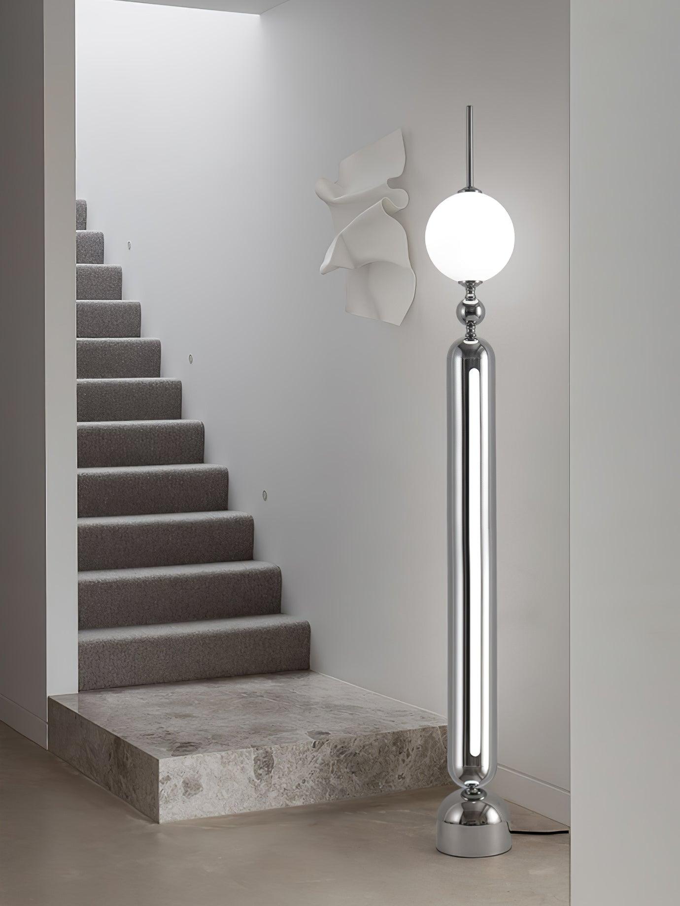 Lightning Rod chrome floor lamp with a white globe and vertical light strip