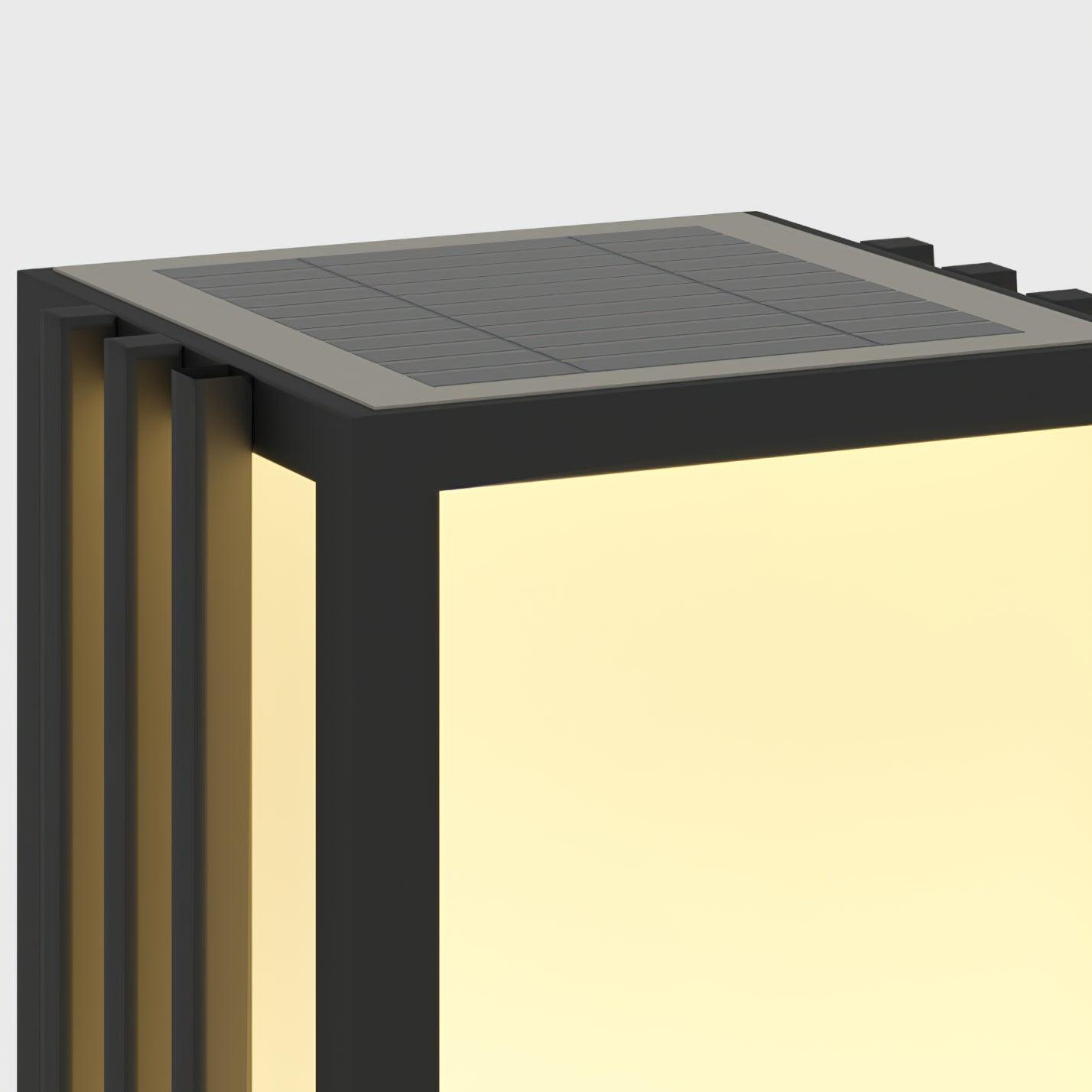 Close-up of segmented solar panel across lantern top, with pale border, black side fins and glowing front panel