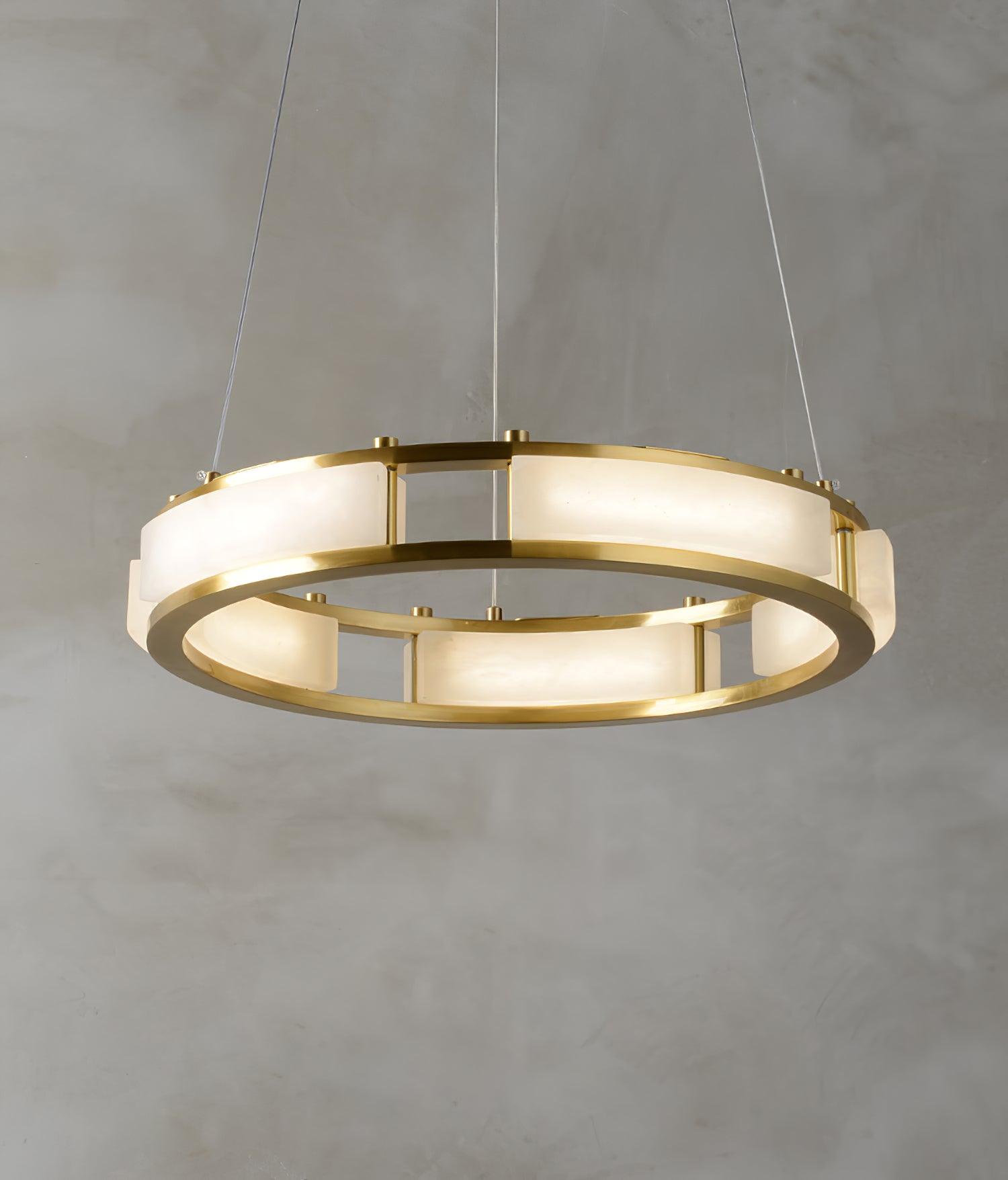 Qatar ring chandelier showing pale stone panels and brass supports