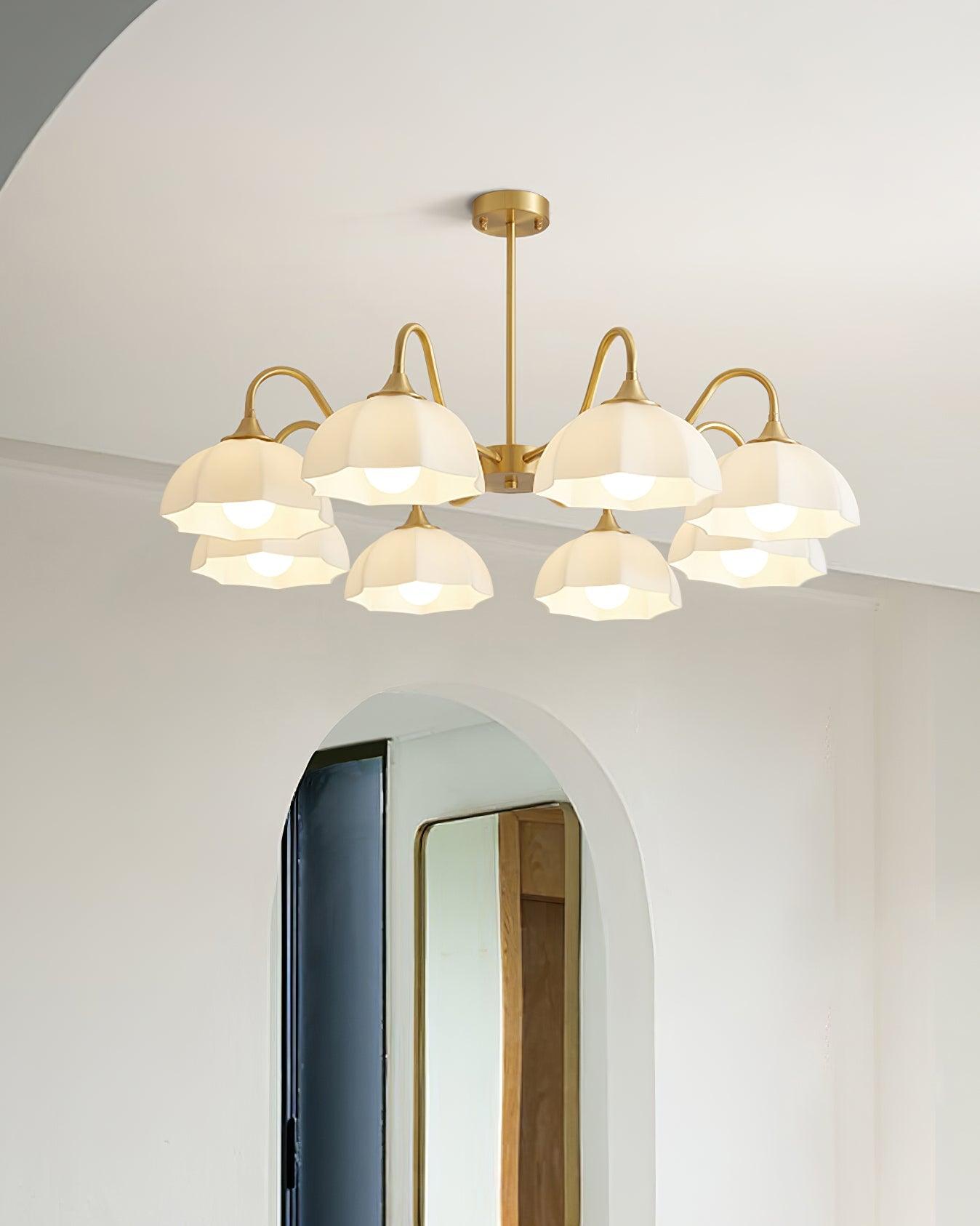 Wide glass-bowl chandelier near arched doorway