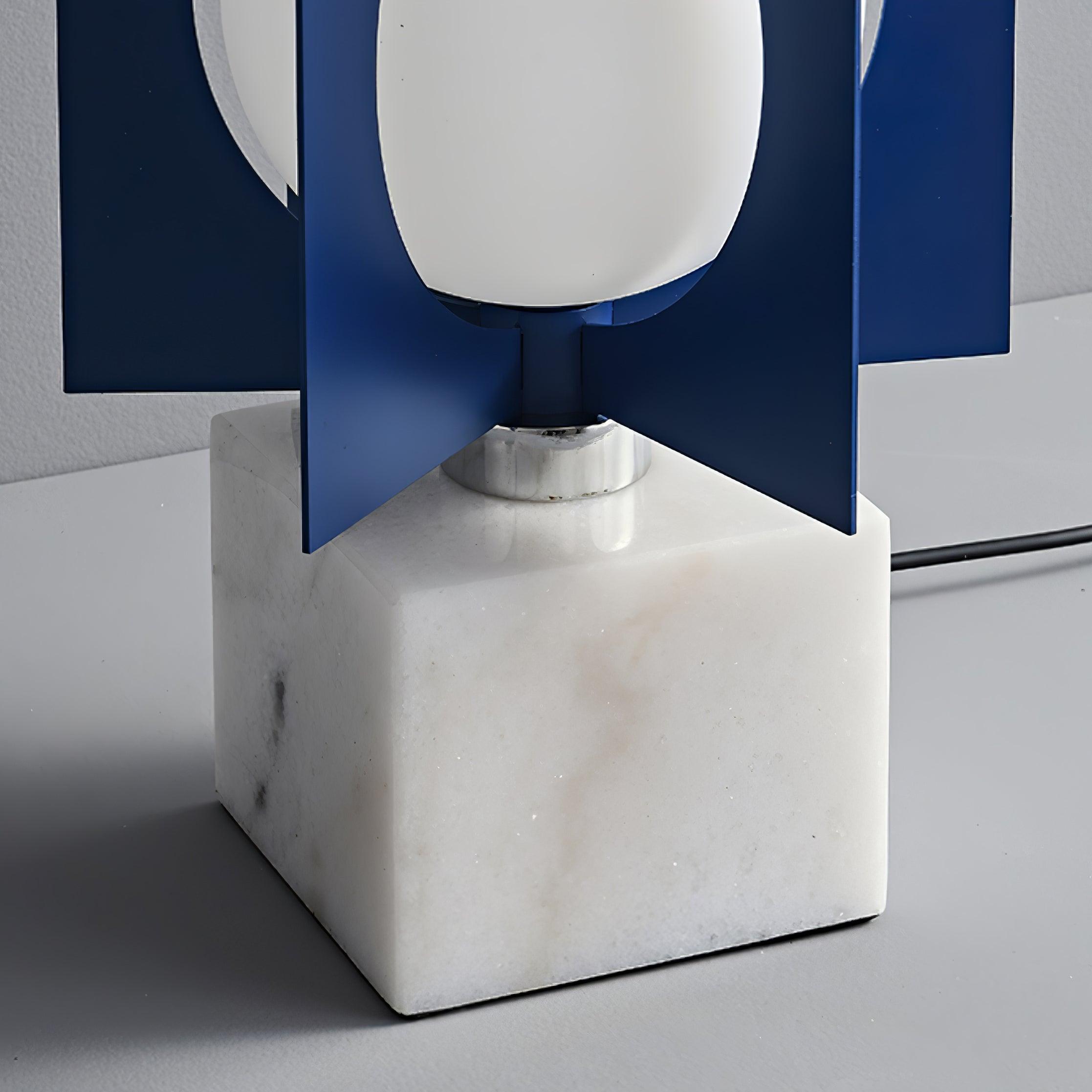 Alternate close-up of the white marble base, reflective collar and lower blue fins with trailing lead