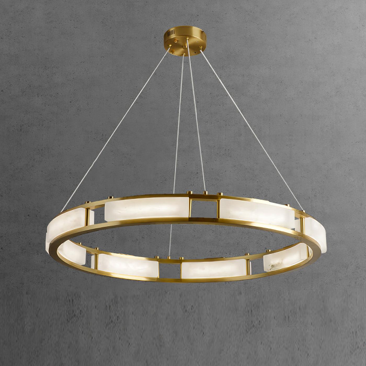 Qatar brass ring and pale alabaster panels against a dark grey background