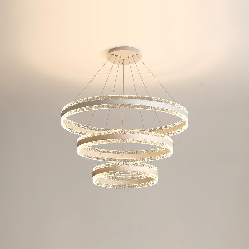 Three-layer White option showing three descending textured-edge LED rings and a round canopy