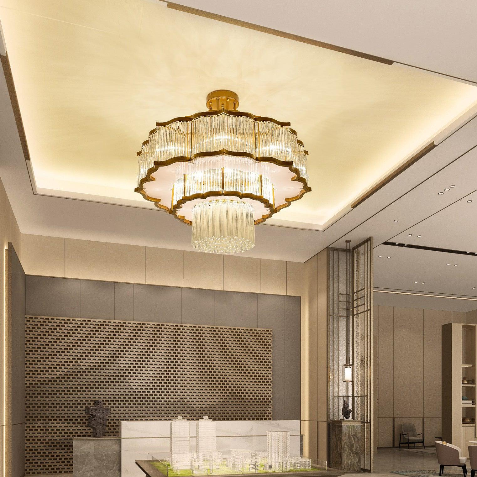 Pharo II tiered chandelier with clear ridged elements and a scalloped metal frame