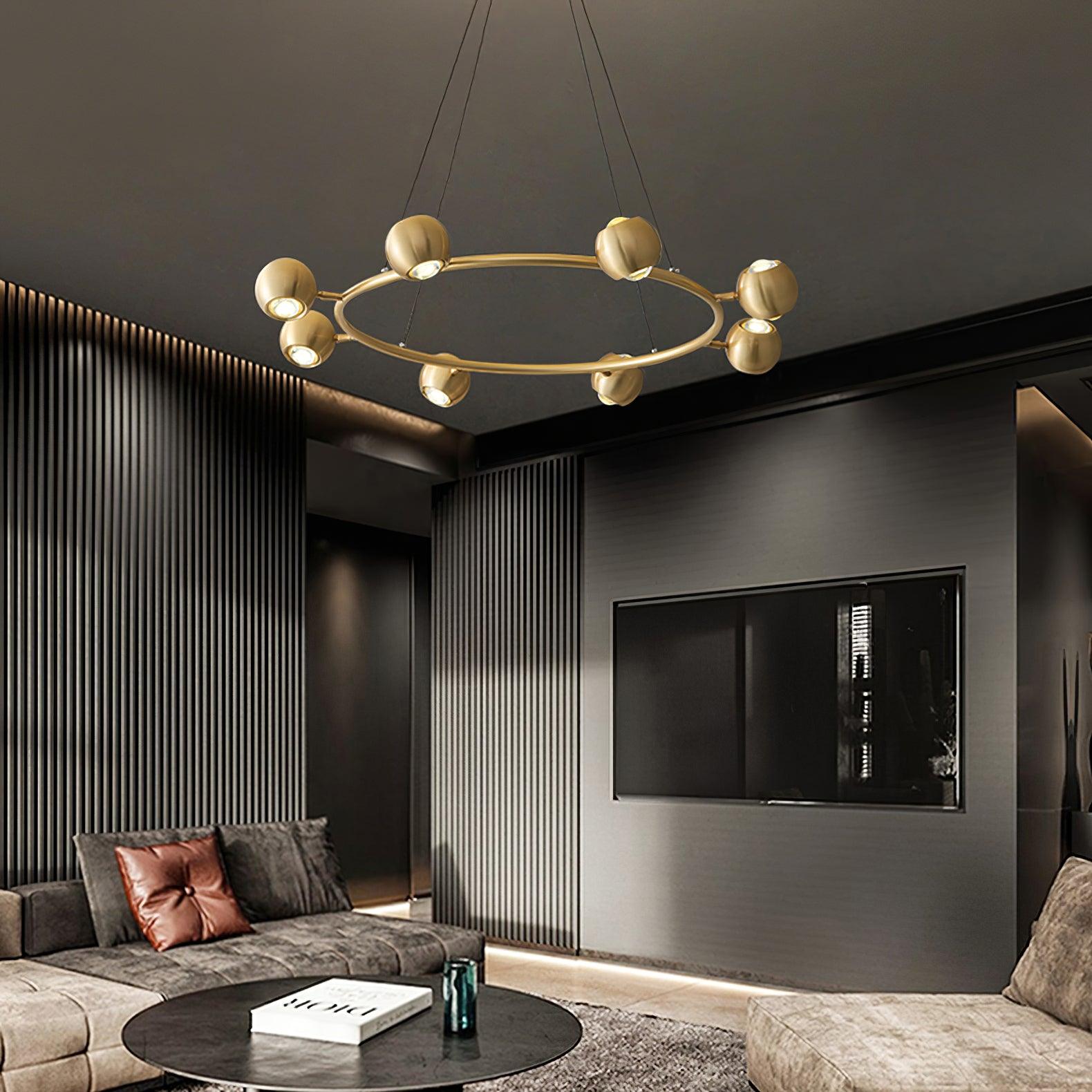 Underside of a brass ring chandelier above a seating area