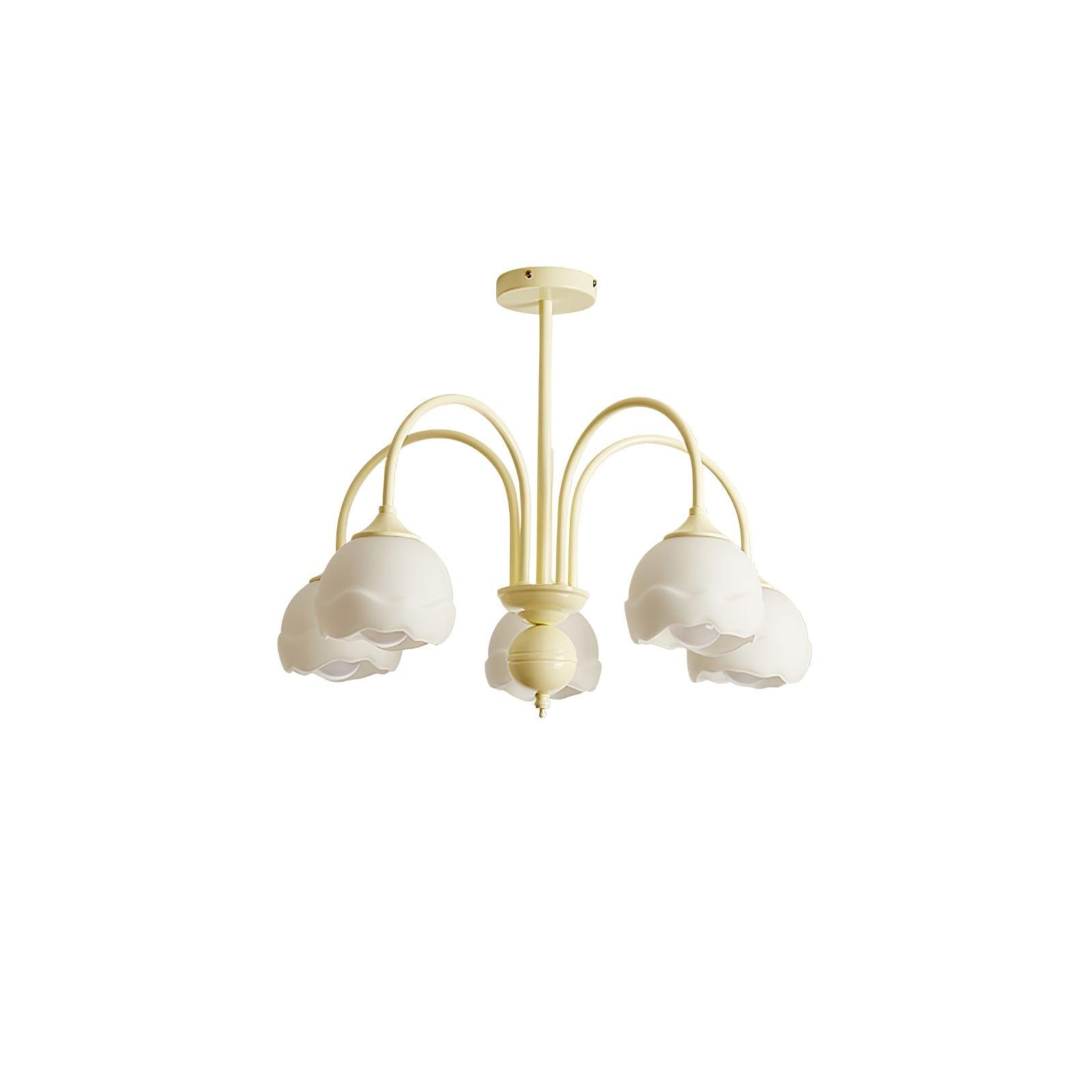 Five-light cream chandelier with curved arms and white scalloped glass shades on a white background