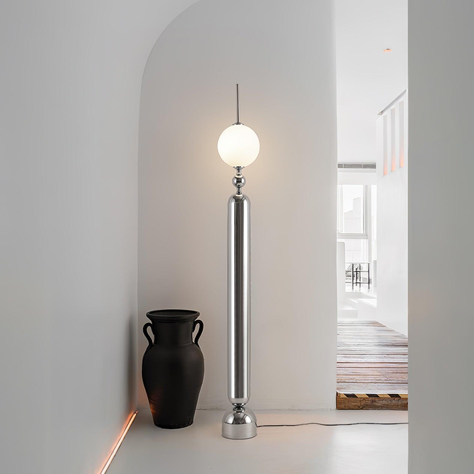 Lightning Rod chrome floor lamp with a white globe and vertical light strip