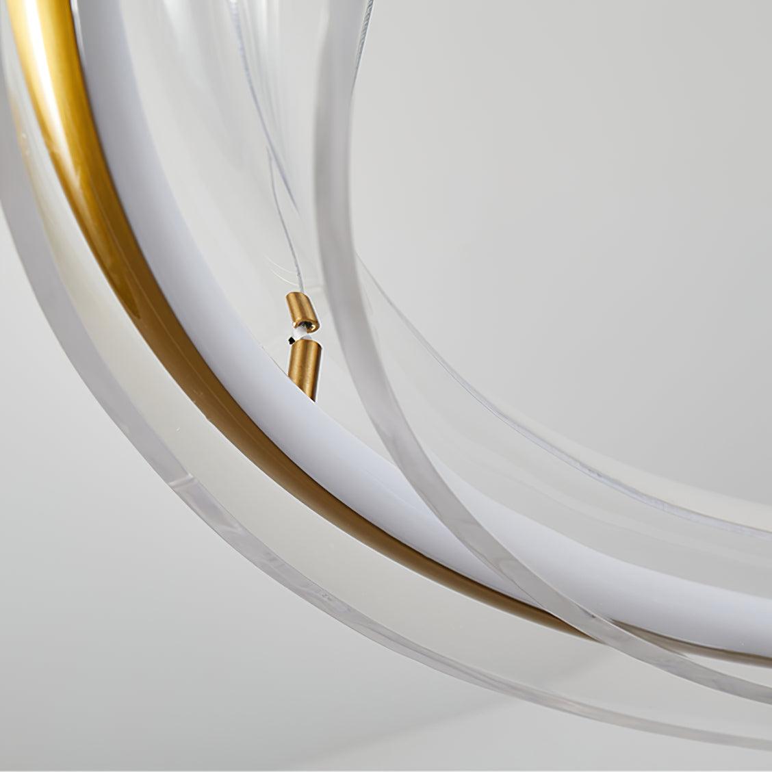 Detail of a suspension fastener beside the clear arc and gold-coloured rail