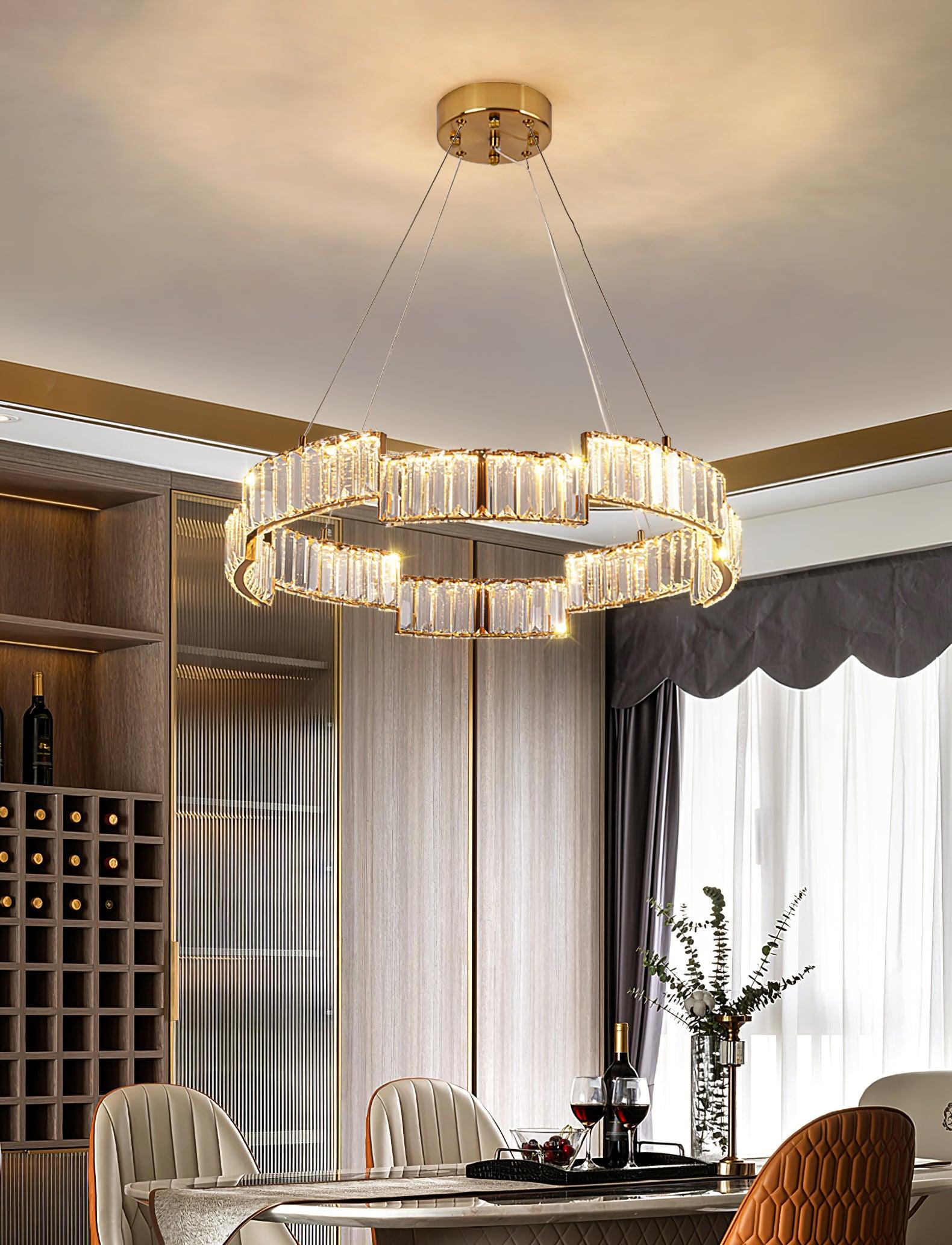Glass ring chandelier in dining room with wine cabinet, wooden slats, table flowers, quilted chairs and sheer curtains