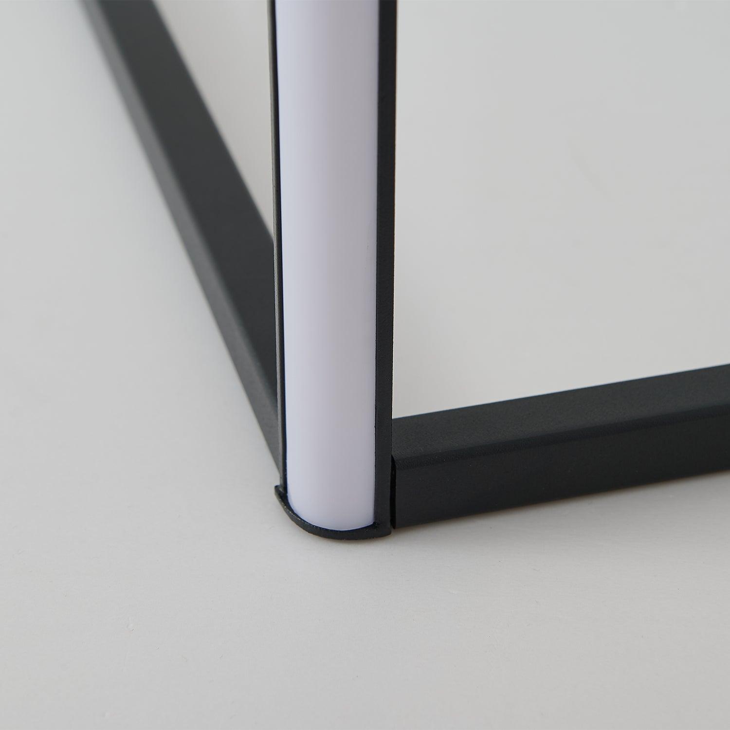 Close-up of the pale diffuser, black upright housing and two foot sections at the base junction