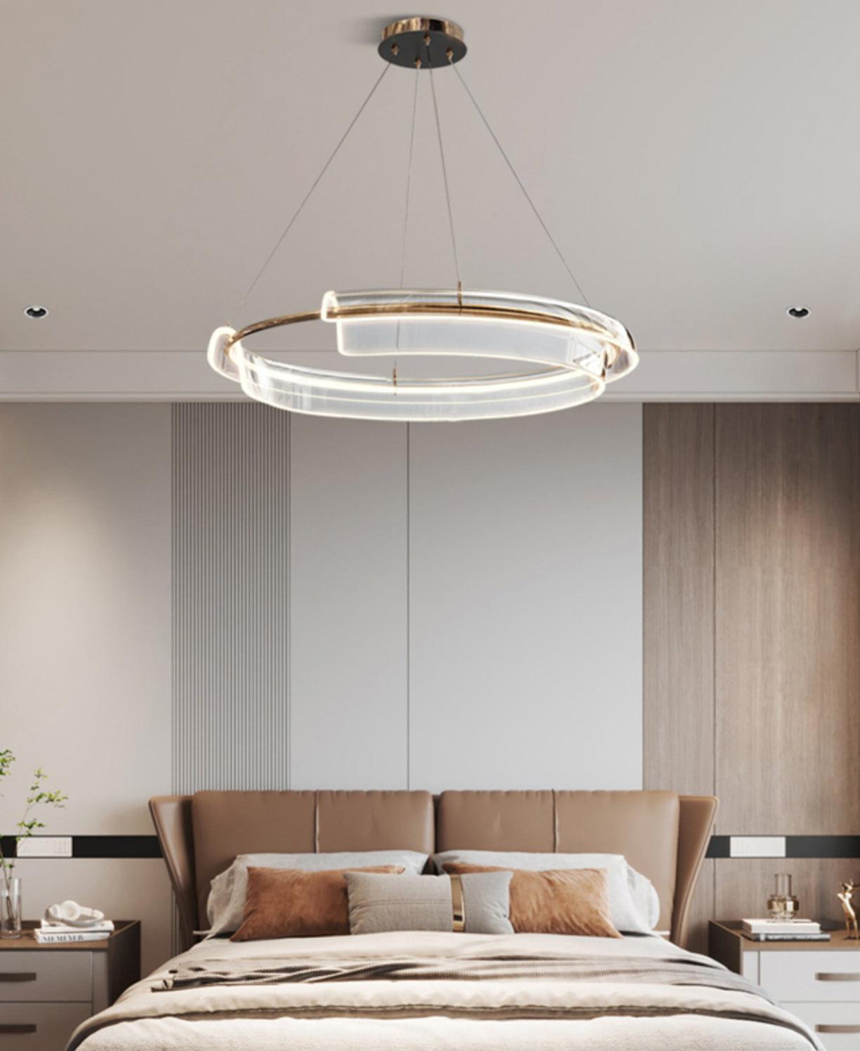 Ring chandelier above a bed